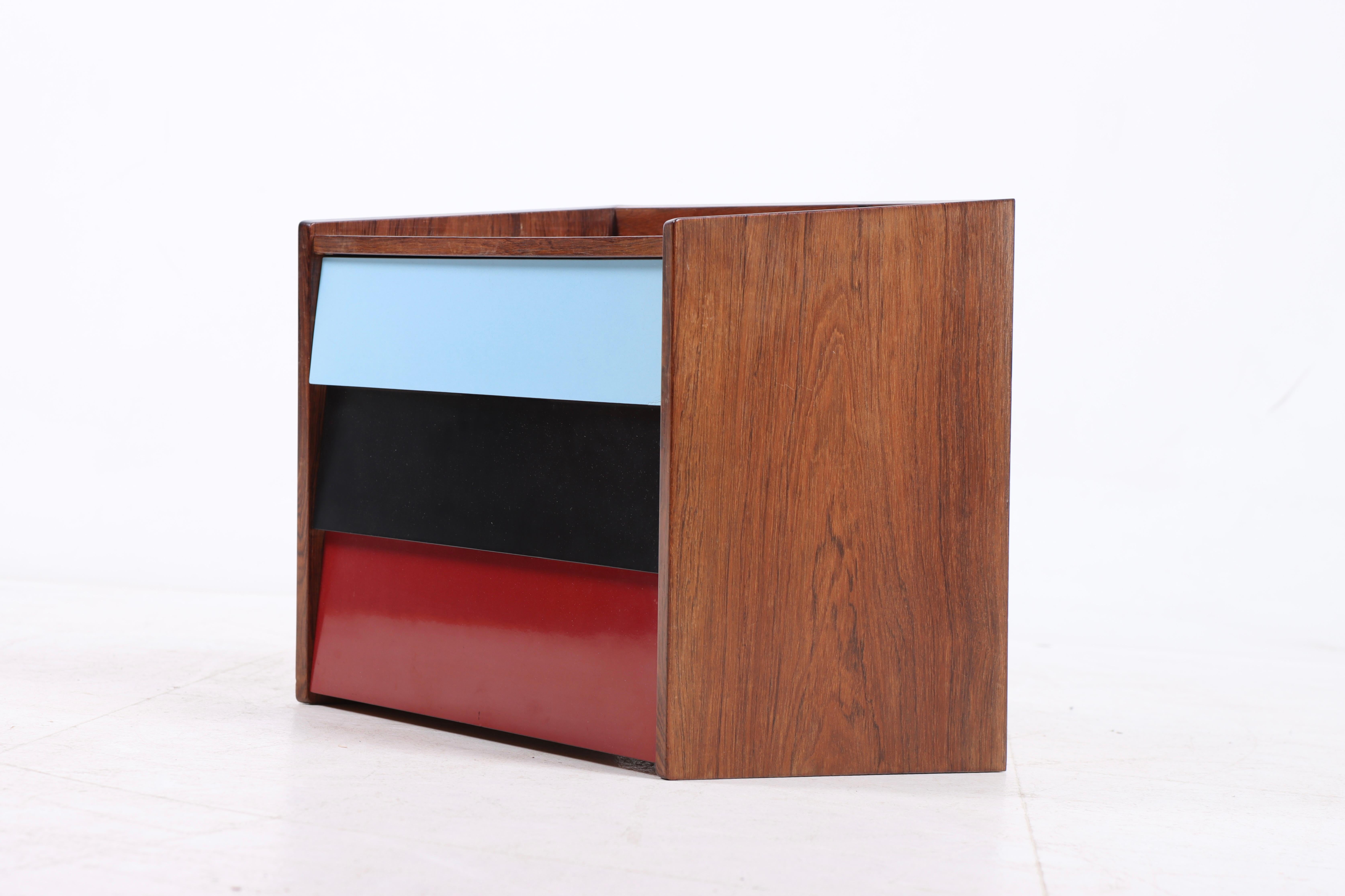 Midcentury wall mounted commode in rosewood with formica, designed and made in Denmark, 1960s.