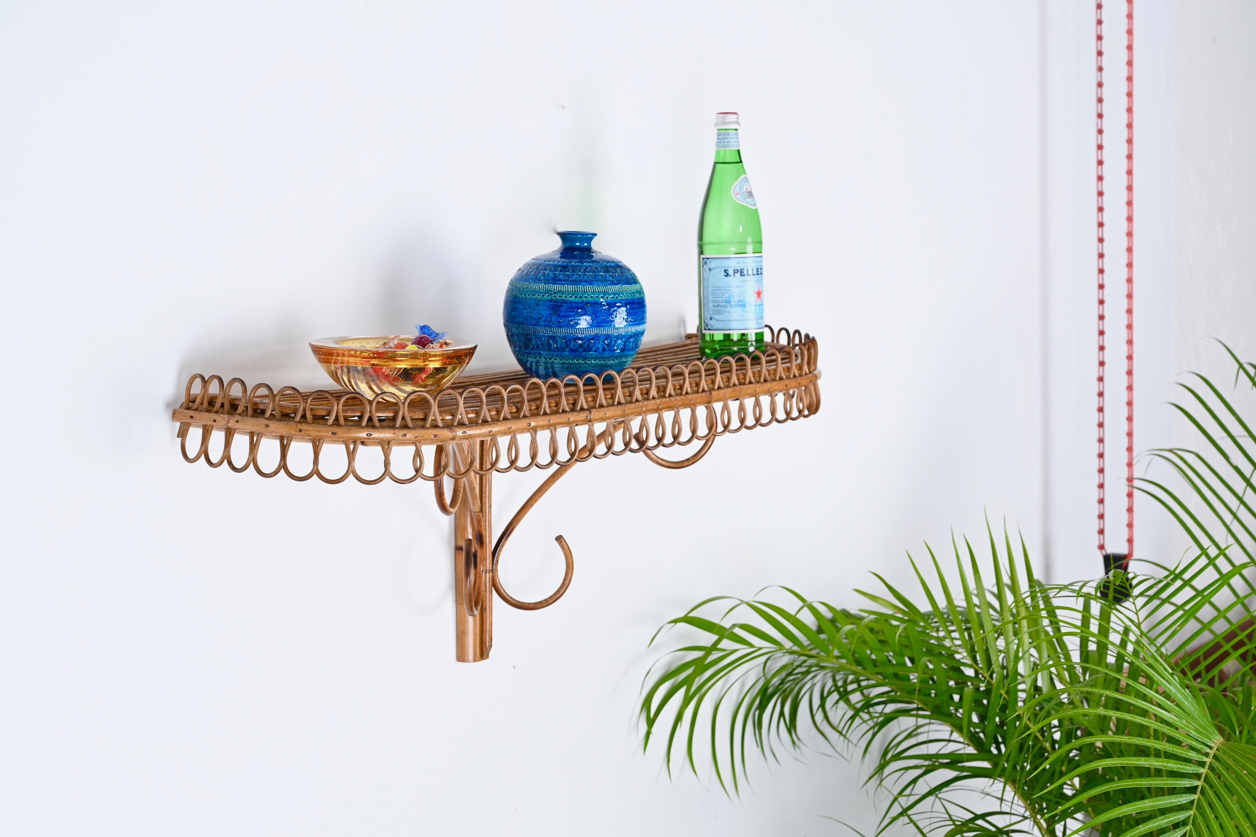Marvellous large rectangular wall shelf in bamboo and rattan. This unique object was made in Italy in the 1960s and is attributed to the mastery of Franco Albini.

This lovely item can be used as a wall shelf or as a console and consist of a large