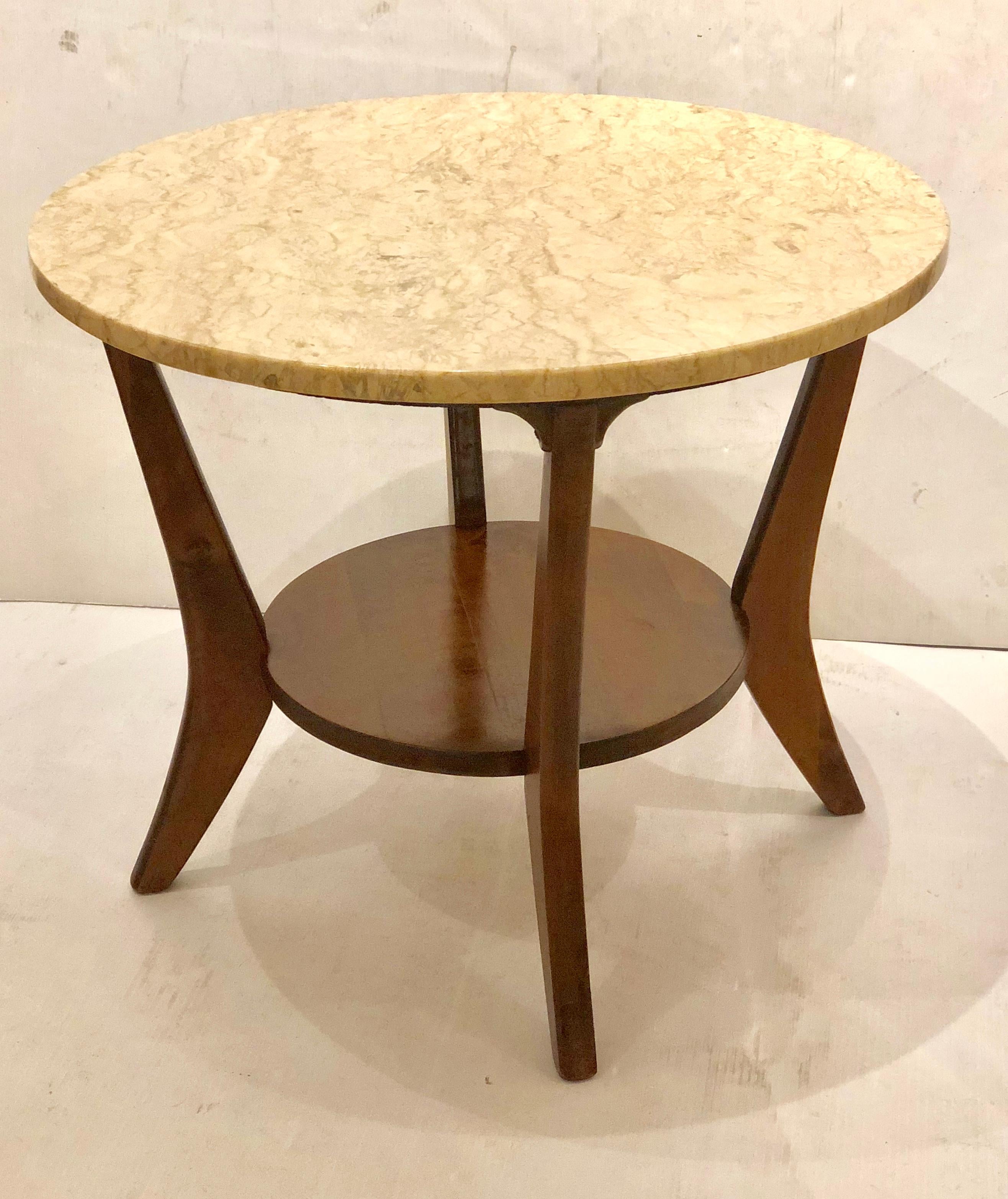 Nice 4 legged round cocktail end/coffee table in the style of Adrian Pearsall , in walnut base with shelf and a solid marble top , all in its original condition.
