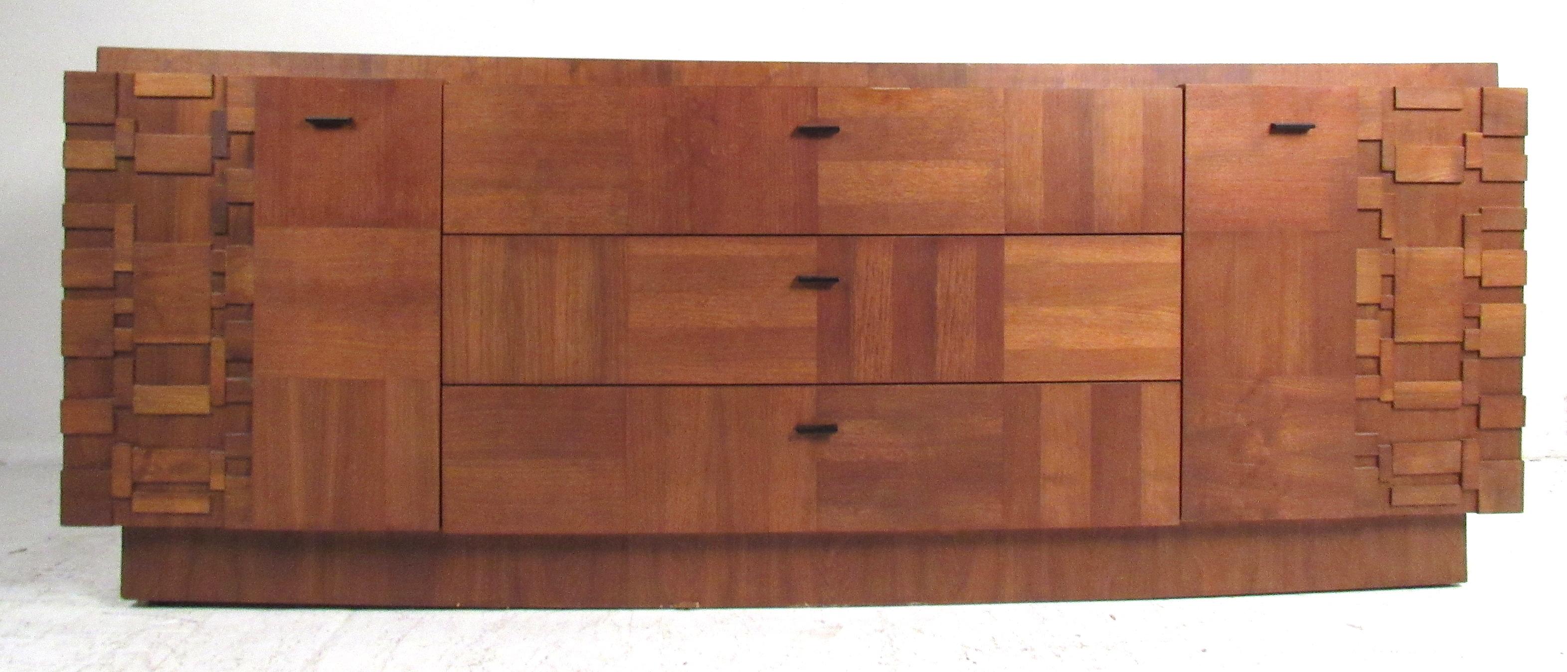 Dramatic five piece Brutalist bedroom set made in Canada, 1975. Dimensional patchwork design with a contrasting parquet style walnut construction makes a impressive Brutalist statement. Set consists of a tall wardrobe, a long low dresser with