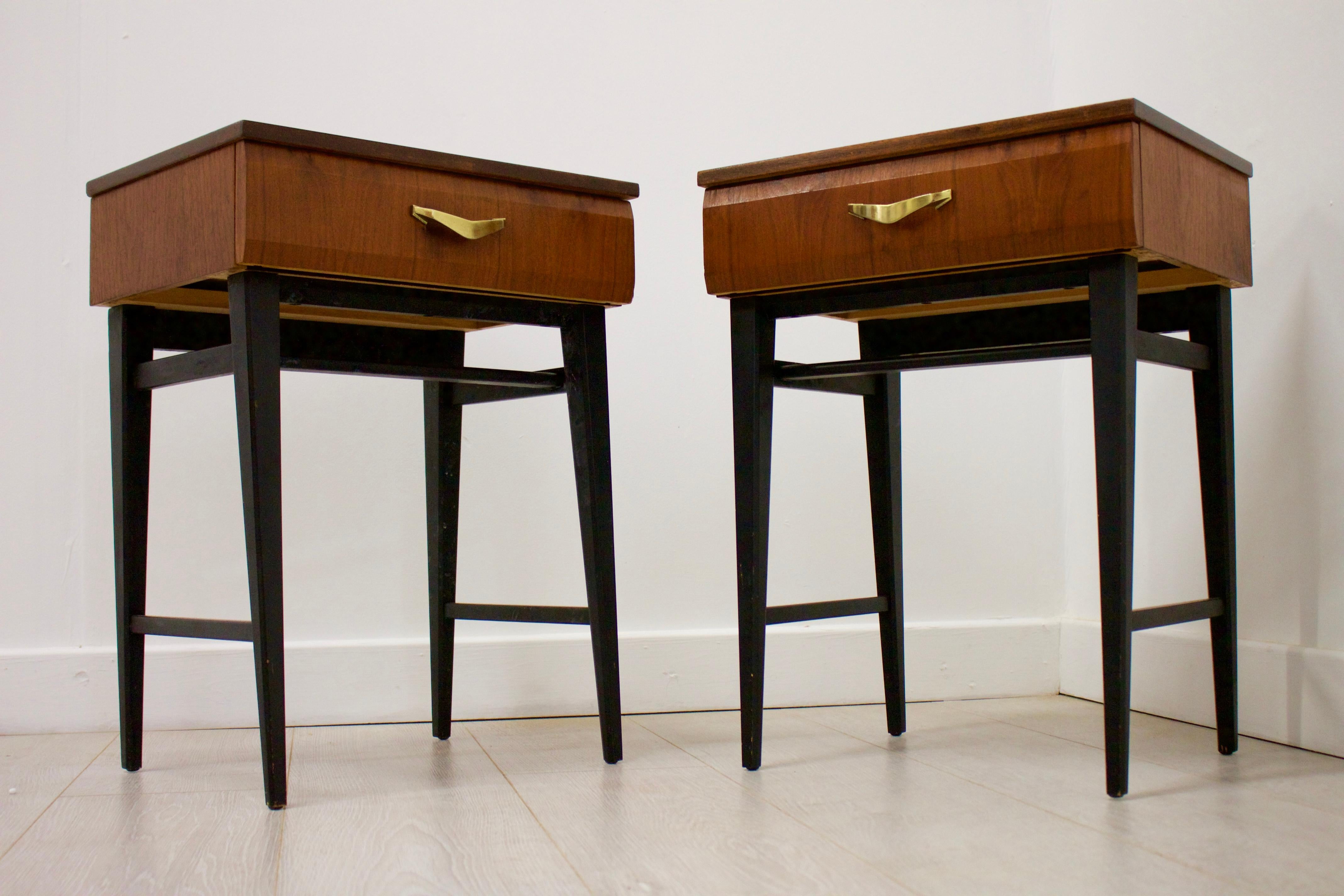 - This is a pair of Italian influenced midcentury bedside cabinet / tables.
- Made in the UK by Meredew
- Made from walnut veneer.