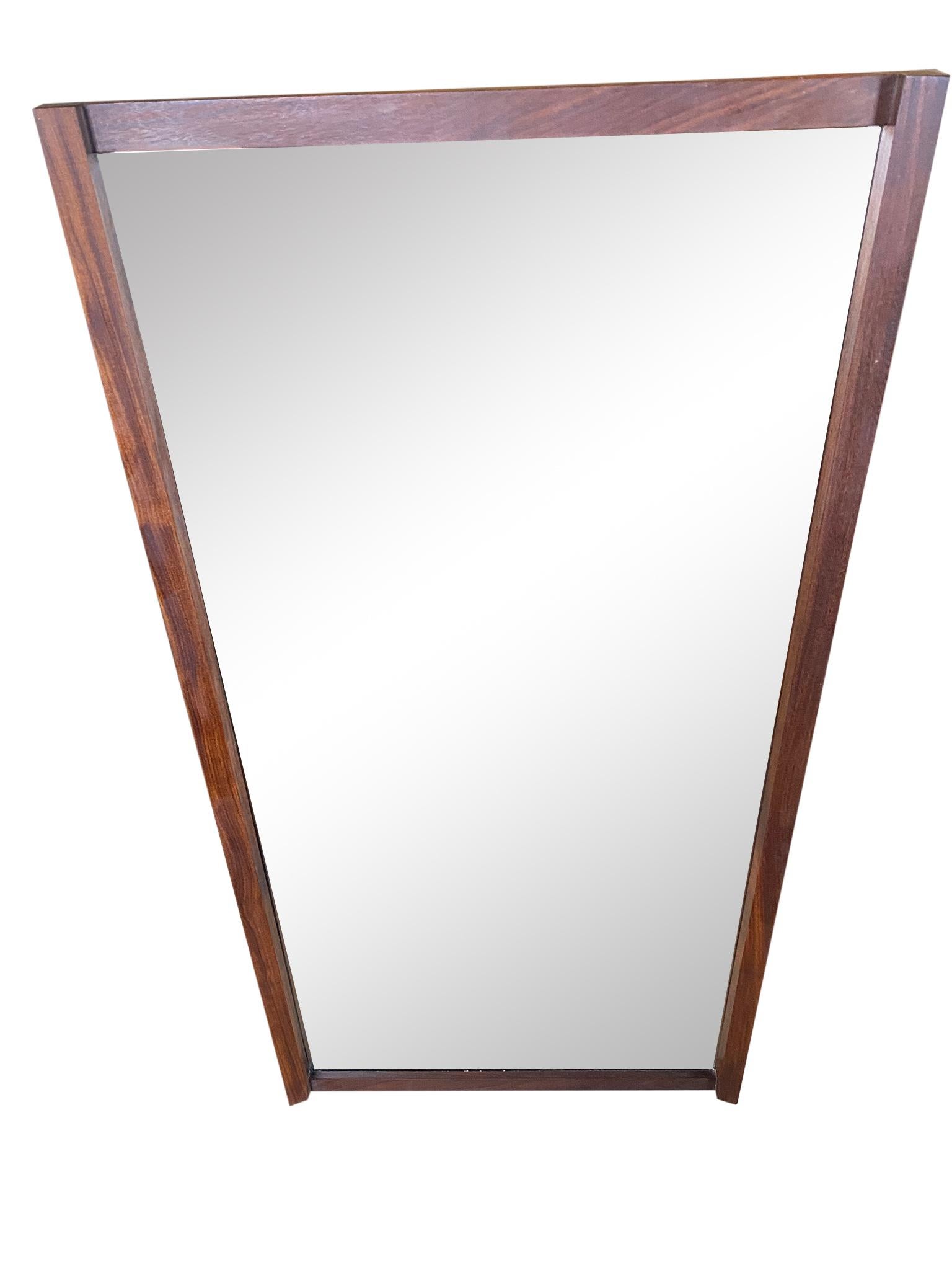 This wonderful Mid-Century Modern walnut mirror designed with amazing tsugite jointry. Style of Nakashima - no label. Wired to hang vertical but can be wired to hang horizontal. Beautiful vintage condition and woodworking.

  