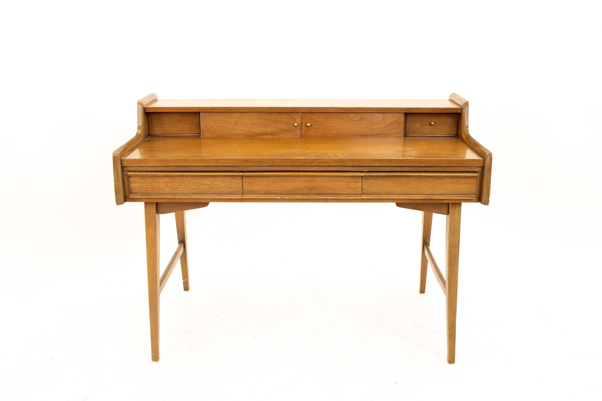 Mid Century walnut secretary desk
Desk measures: 48 wide x 23.75 deep x 34.75 high

All pieces of furniture can be had in what we call restored vintage condition. This means the piece is restored upon purchase so it’s free of watermarks, chips or