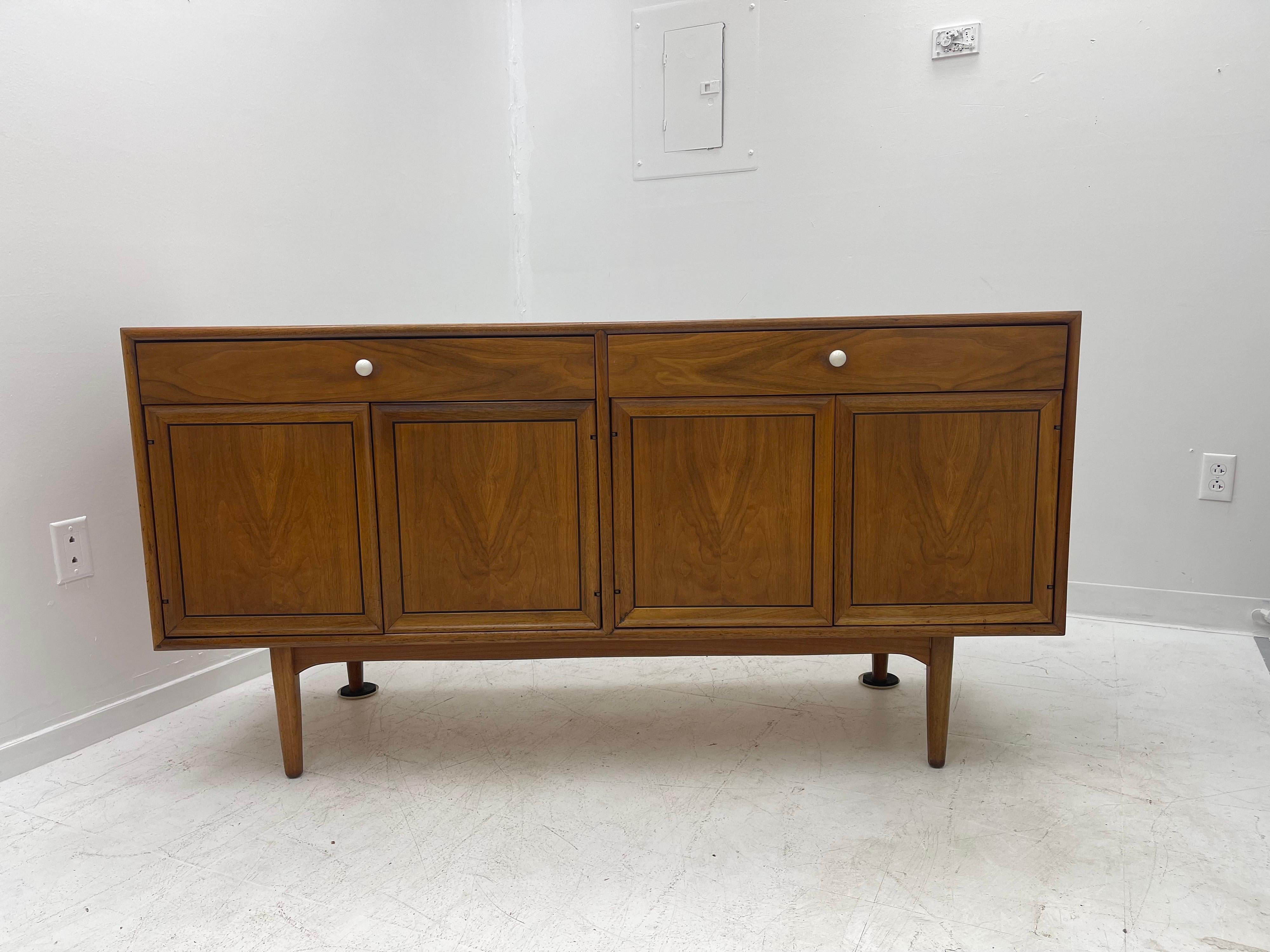 Beautiful wood grain with clean lines, this walnut sideboard was designed by Kip Stewart and Stewart MacDougall for the 