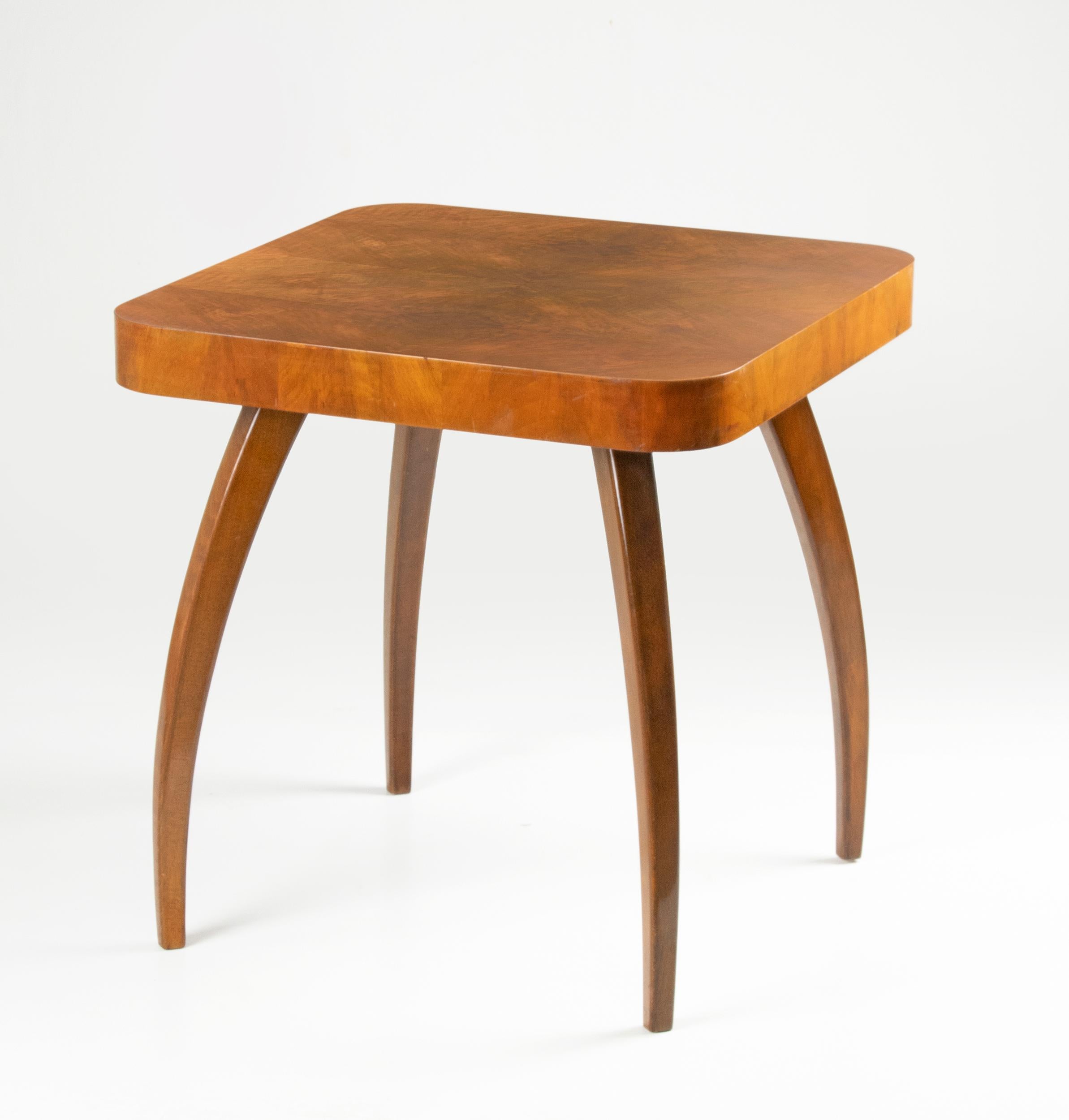 A design classic side table by Czech designer and architect Jindrich Halabala ( 1903-1978 ) for UP Zavody. This Art Deco style side table has a square top with rounded corners and four stylised bentwood spider legs. The table is made from beechwood