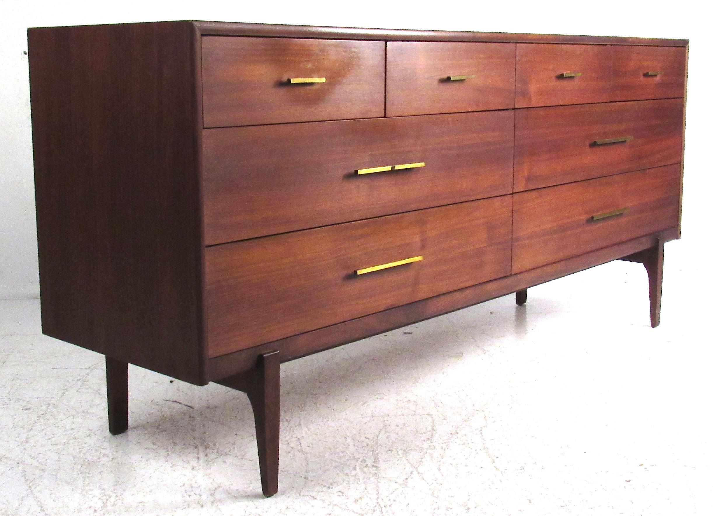 Mid-Century Modern American walnut eight-drawer dresser with matching mirror and single nightstand. Please confirm item location (NY or NJ) with dealer.