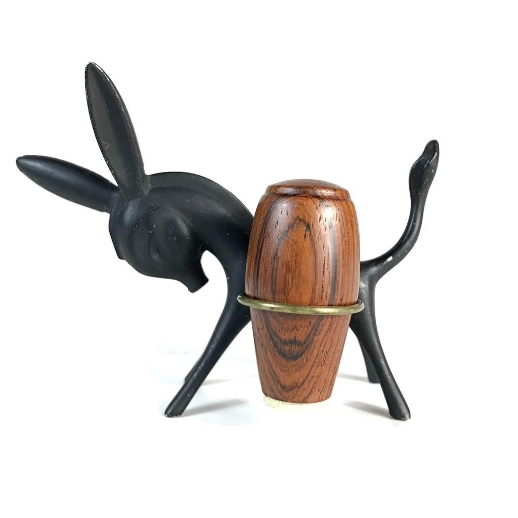 Beautiful Austrian midcentury salt and pepper Shaker, designed by Walter Bosse and made by Hertha Baller in 1950s. The donkey is made of matte lacquered metal and polished brass Shaker holder. The shakers are made of rosewood and look like barrels.