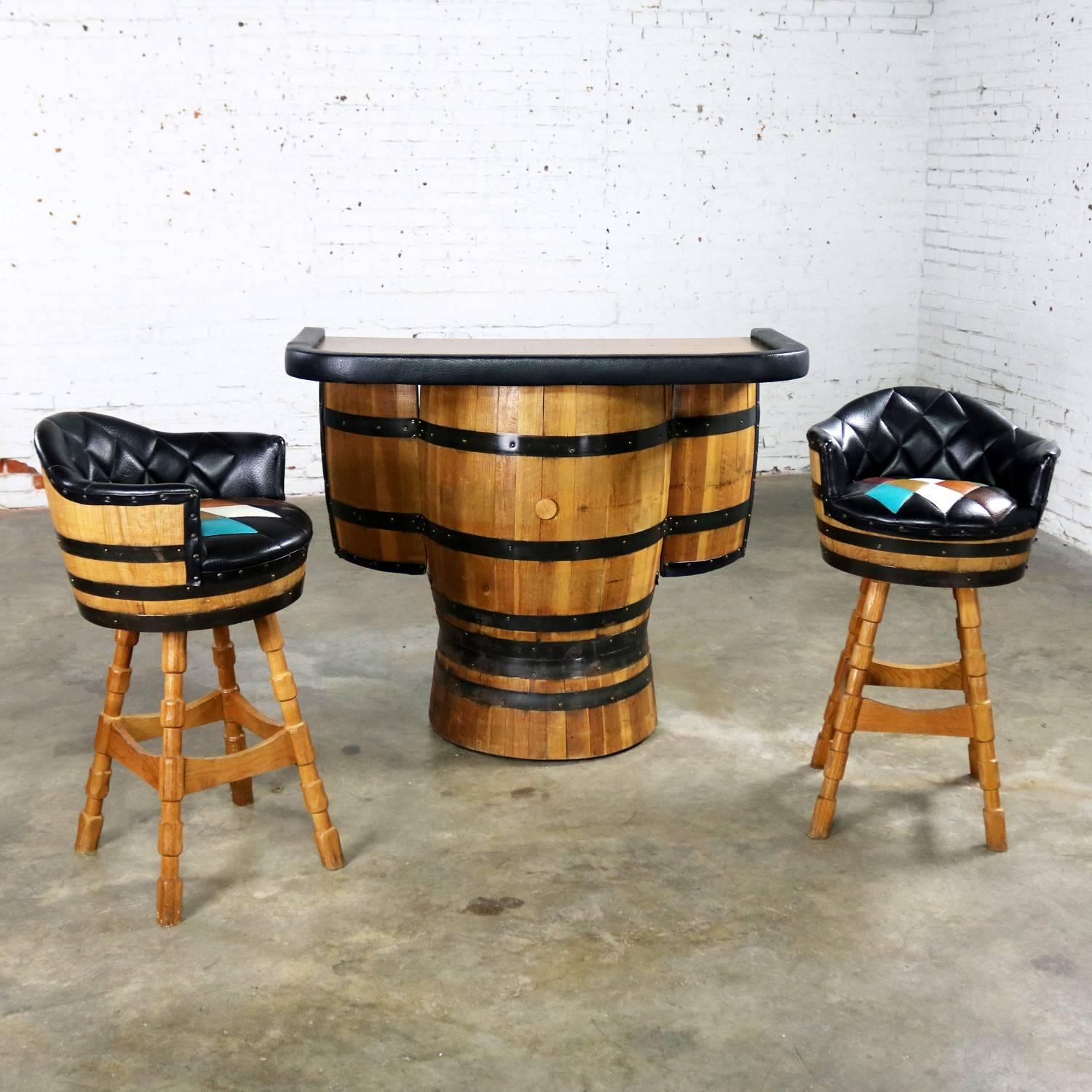 Fun and Funky midcentury whiskey barrel bar and pair of bar stools with a diamond somewhat argyle sewed in pattern in the upholstery by Brothers Furniture of Kentucky. This set is in fabulous vintage condition. There are a few flaws in the