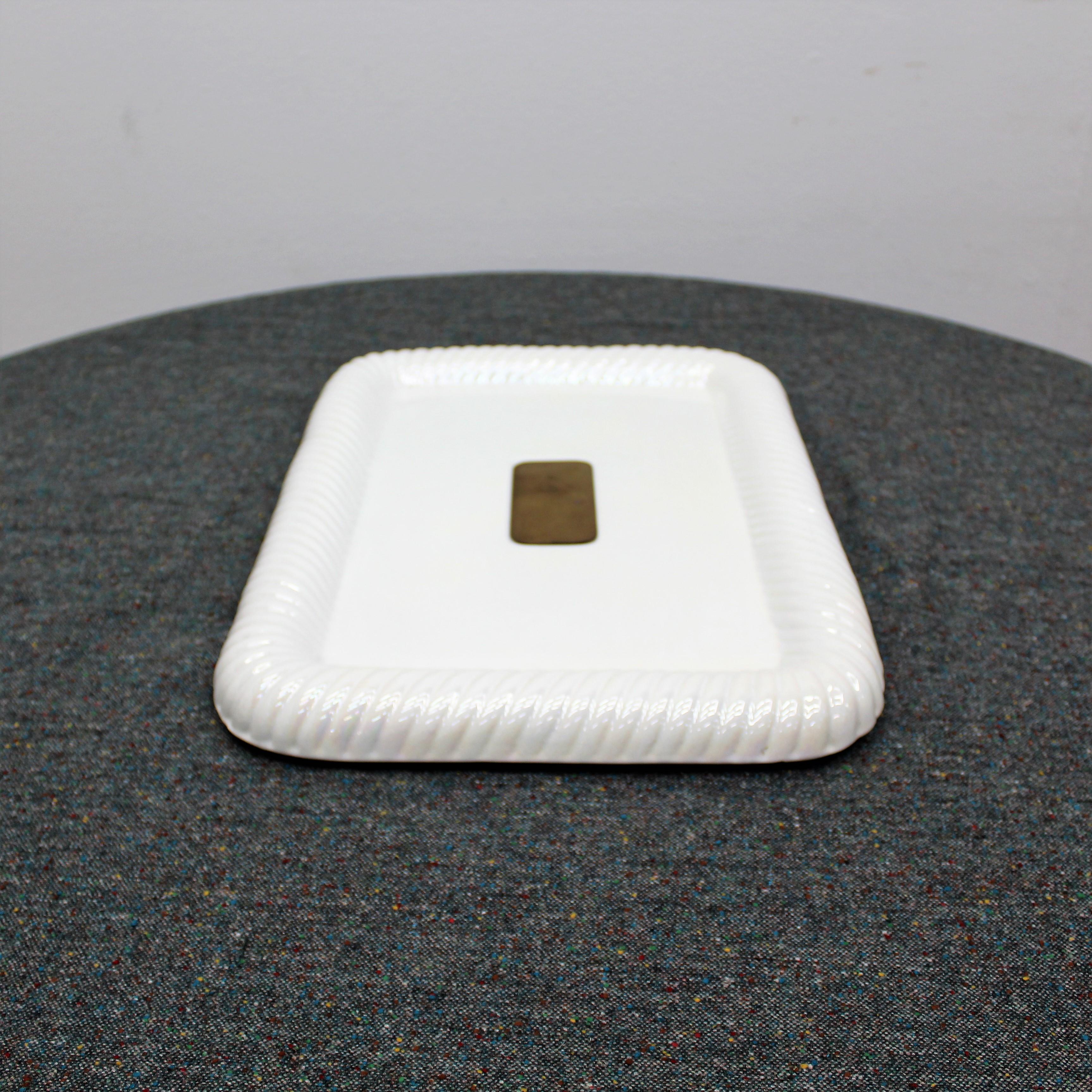 Tommaso Barbi tray in white glazed ceramic and brass. Signed with label on the bottom. Wear consistent with age and use.