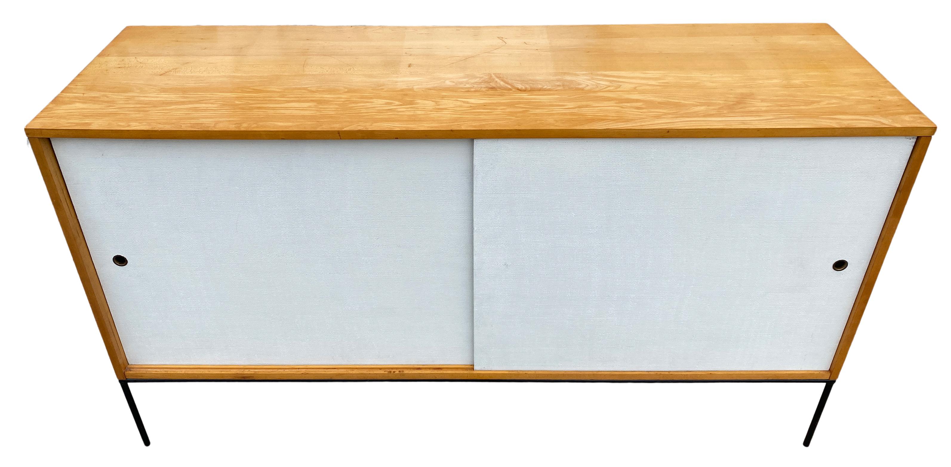 Beautiful clean midcentury tall credenza sideboard by Paul McCobb circa 1950 Planner Group #1514. Has 1 adjustable shelve with 4 pins with 1 drawer on the left side and 3 drawers on the right side. Solid maple construction with an original Raw