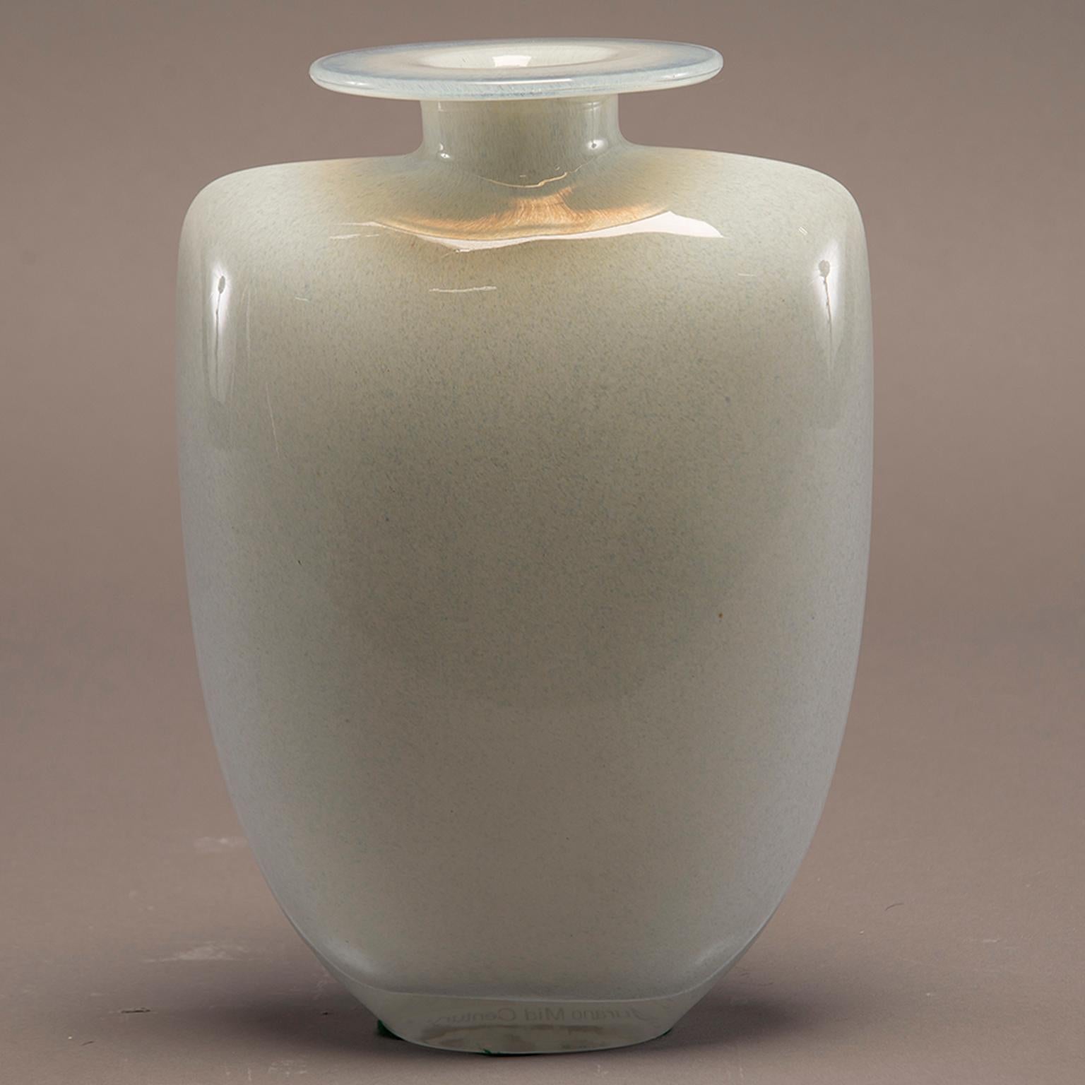 White art glass vase with modern, sleek form, circa 1960s. Base of vessel has wide shoulders, short neck and wide, flat rim. Believed to be Murano manufacturer. No makers mark found.