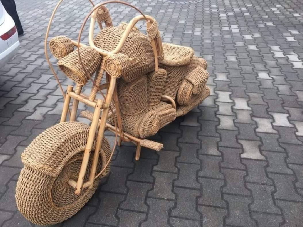 A vintage wicker full size replica of a Harley Davidson motorcycle.