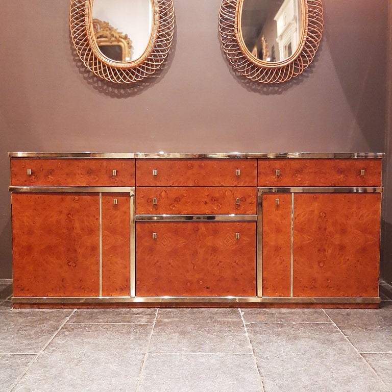 Impressive Italian credenza designed attributed to Willy Rizzo. 

The rich burl wood sides and top in shades of caramel and coffee brown, have a warm, glossy look. True to Willy Rizzo's style the sideboard is finished with chrome detailing in the