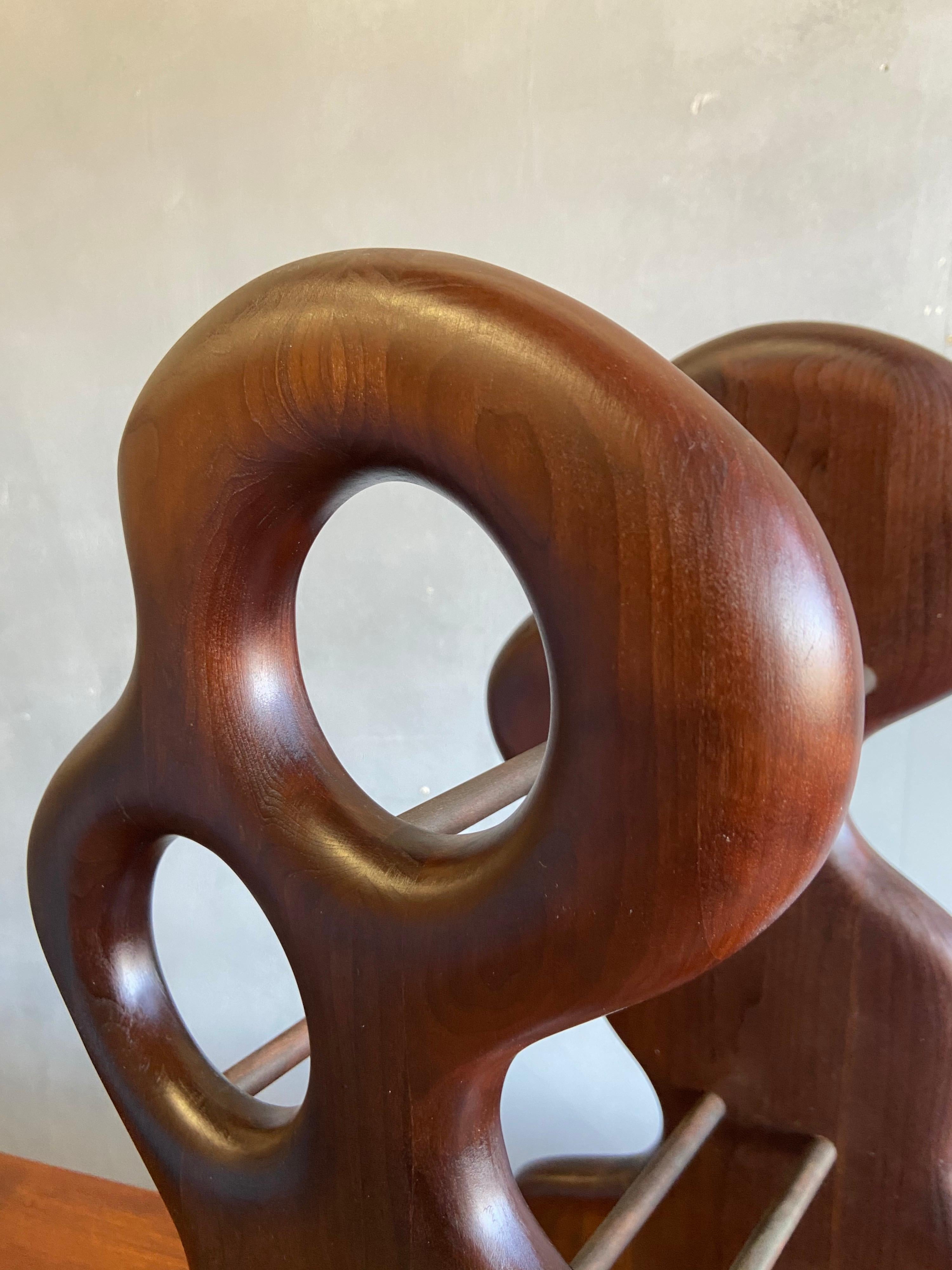 For your consideration is this beautifully sculpted wine holder by Master Craftsman Dean Santner. Santner designs are part of the American Studio Modern Craft movement along side Wendell Castle, Nakashima, Phillip Powell to name a few. This hand