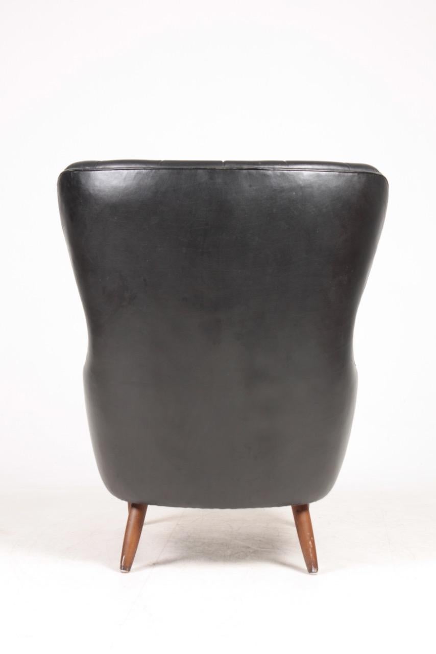 Scandinavian Modern Midcentury Wing Back Chair in Patinated Leather, Denmark, 1960s For Sale