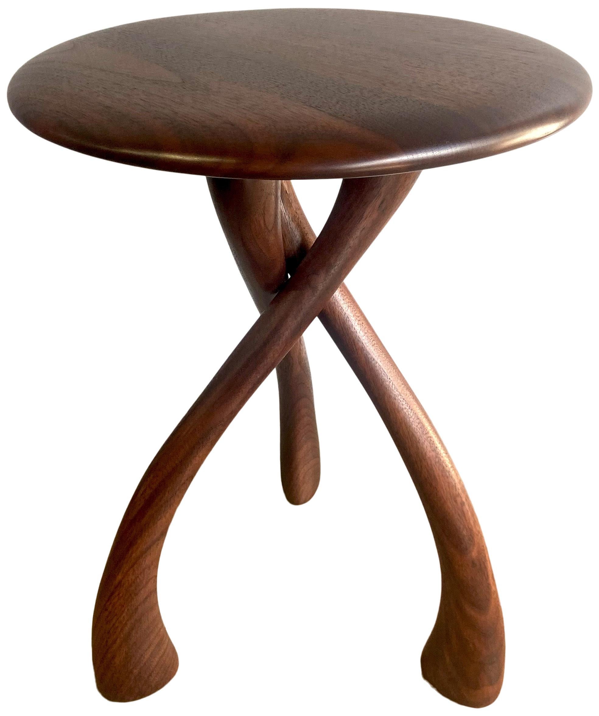 

Beautiful iconic wishbone circular table designed by Dean Santner featuring black walnut construction. This amazing design looks simple yet complex at the same time. Wonderful proportions make great use as a side table, end table, bedside tables