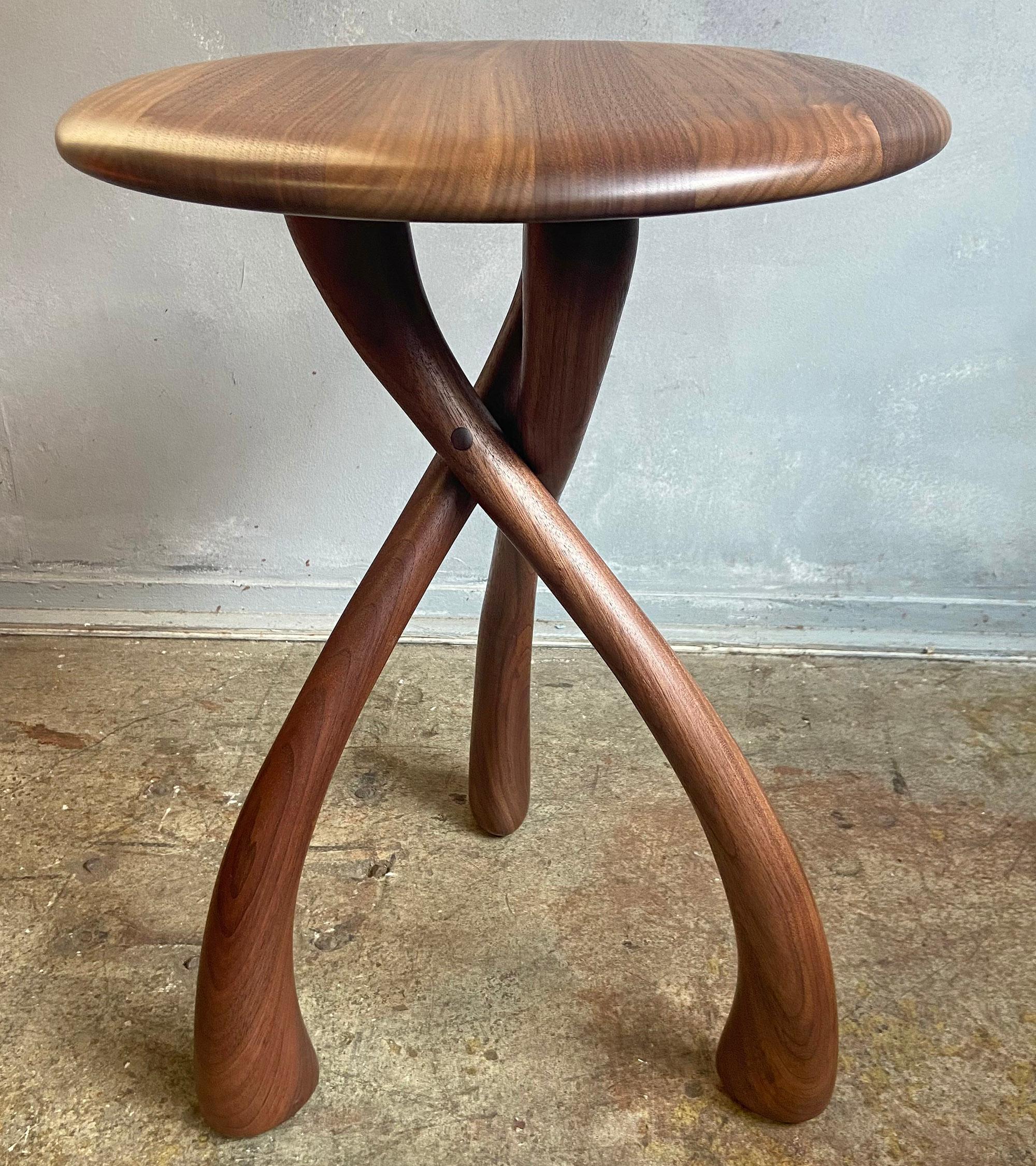 Beautiful wishbone circular tables designed by Dean Santner featuring solid black walnut construction. This amazing design looks simple yet complex at the same time. Gorgeous rounded waterfall edge and graceful carved lines. A wonderful American