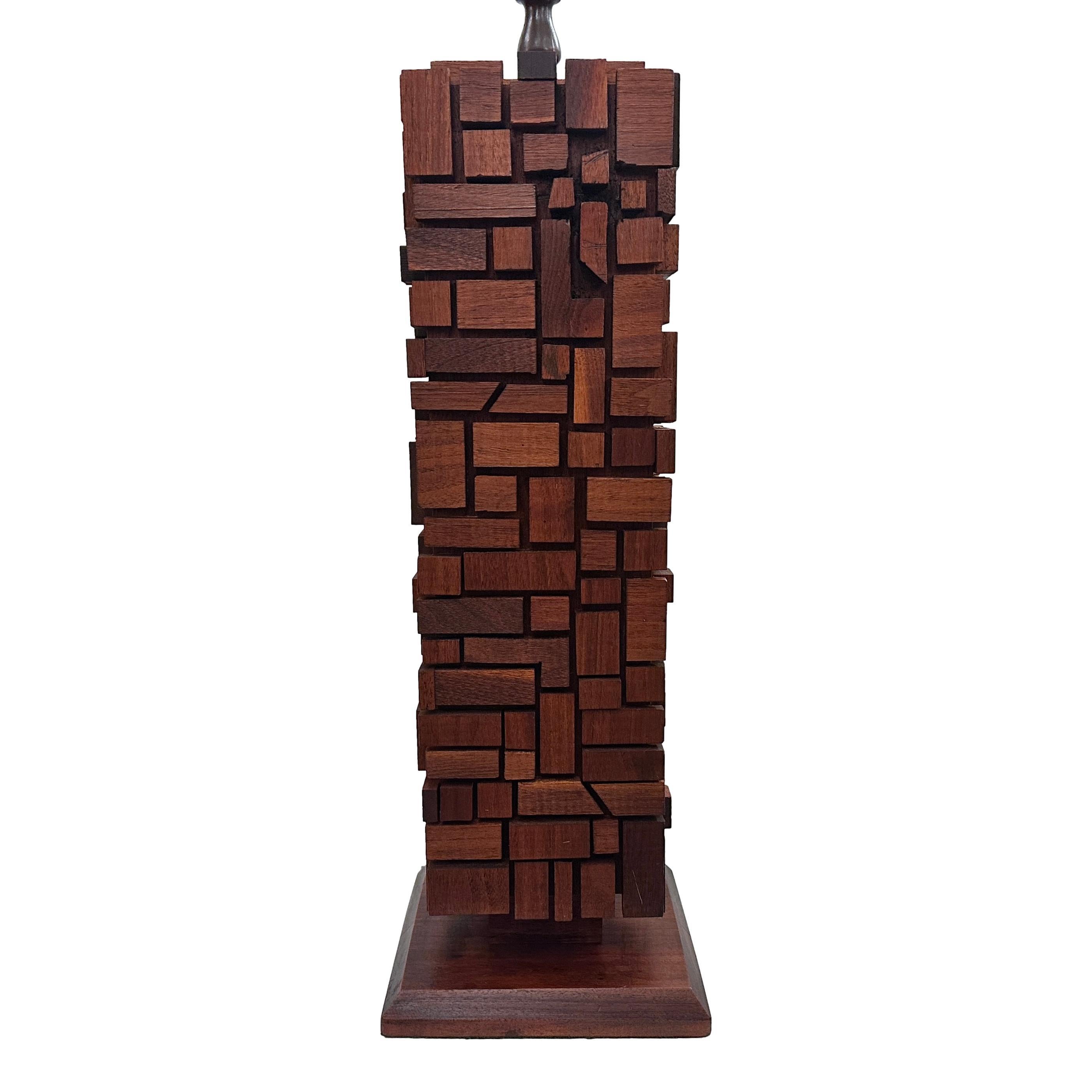 A circa 1960's Italian wooden lamp with abstract design.

Measurements:
Height of body: 21