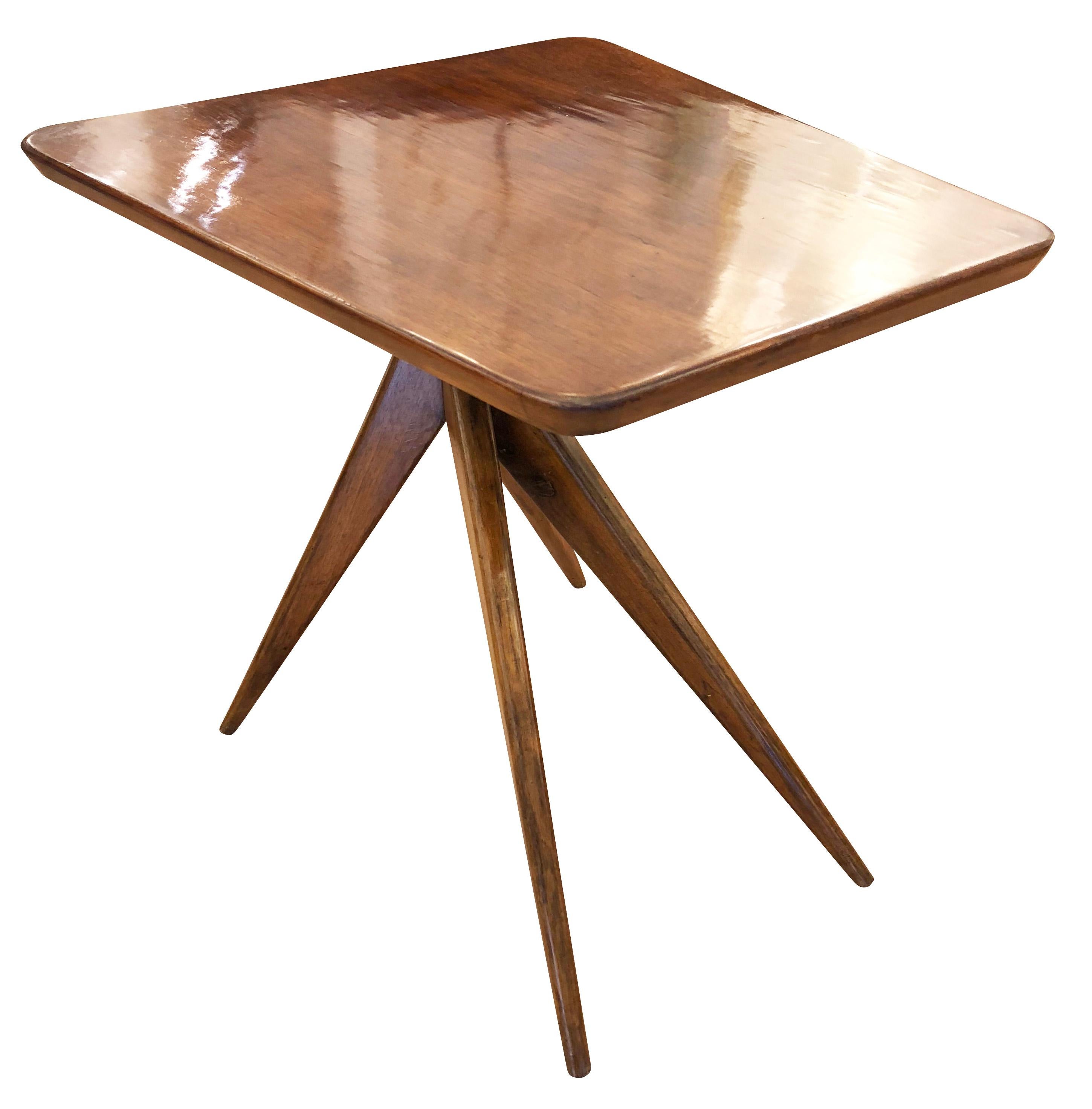 Italian midcentury wood side table with trapezoid top and four tapering legs.

Condition: Excellent vintage condition, minor wear consistent with age and use

Measures: Width 20”

Depth 22”

Height 21.5”.

 