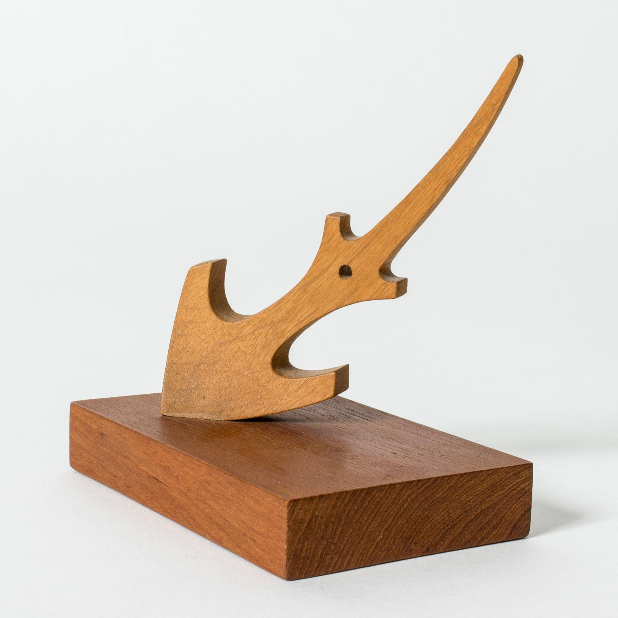 Lovely small anchor sculpture by Johnny Mattsson, sculpted from teak.

Aquatic themes are recurring in Johnny Mattsson’s artistry, sailing and the archipelago being important parts of his life. The anchor is also found in the municipal coat of arms