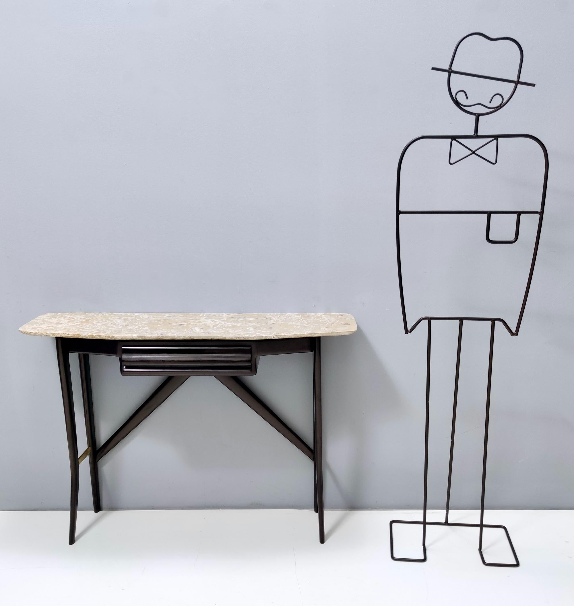 Italy, 1950s.
This console table features a lumachella marble top and an ebonized beech frame.
It is a vintage item, therefore it might show slight traces of use, but it can be considered as in very good original condition and ready to become a