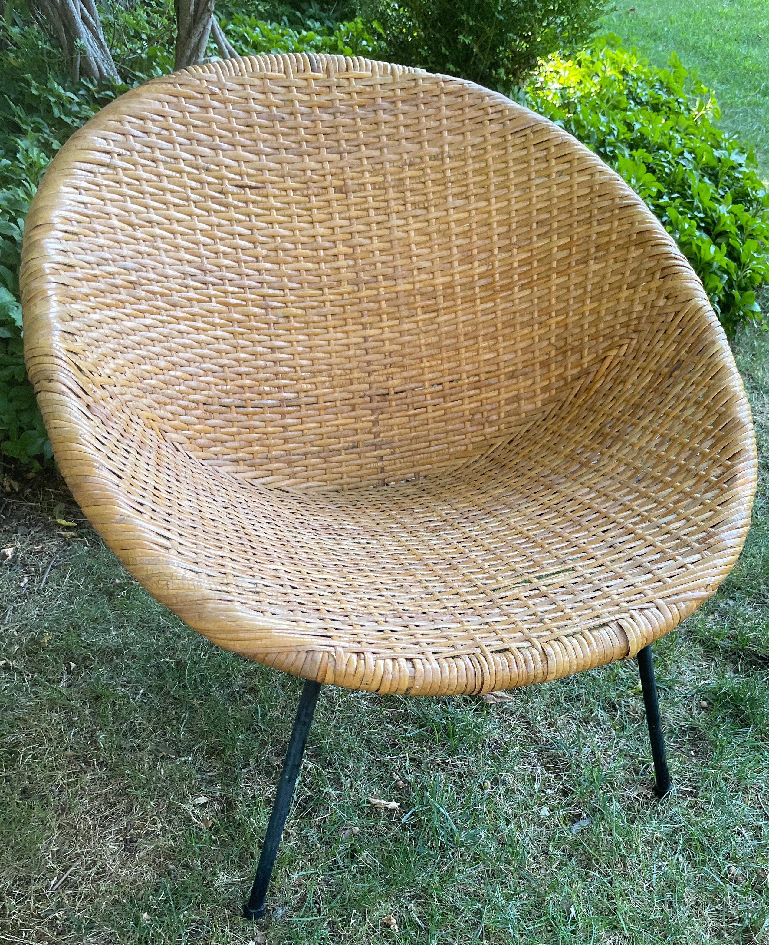 Midcentury woven wicker and bamboo bucket chair. Woven rattan and bamboo bucket chair with metal legs. United States, Mid 20th Century. 
Dimensions: 30” W x 30” D x 26.5