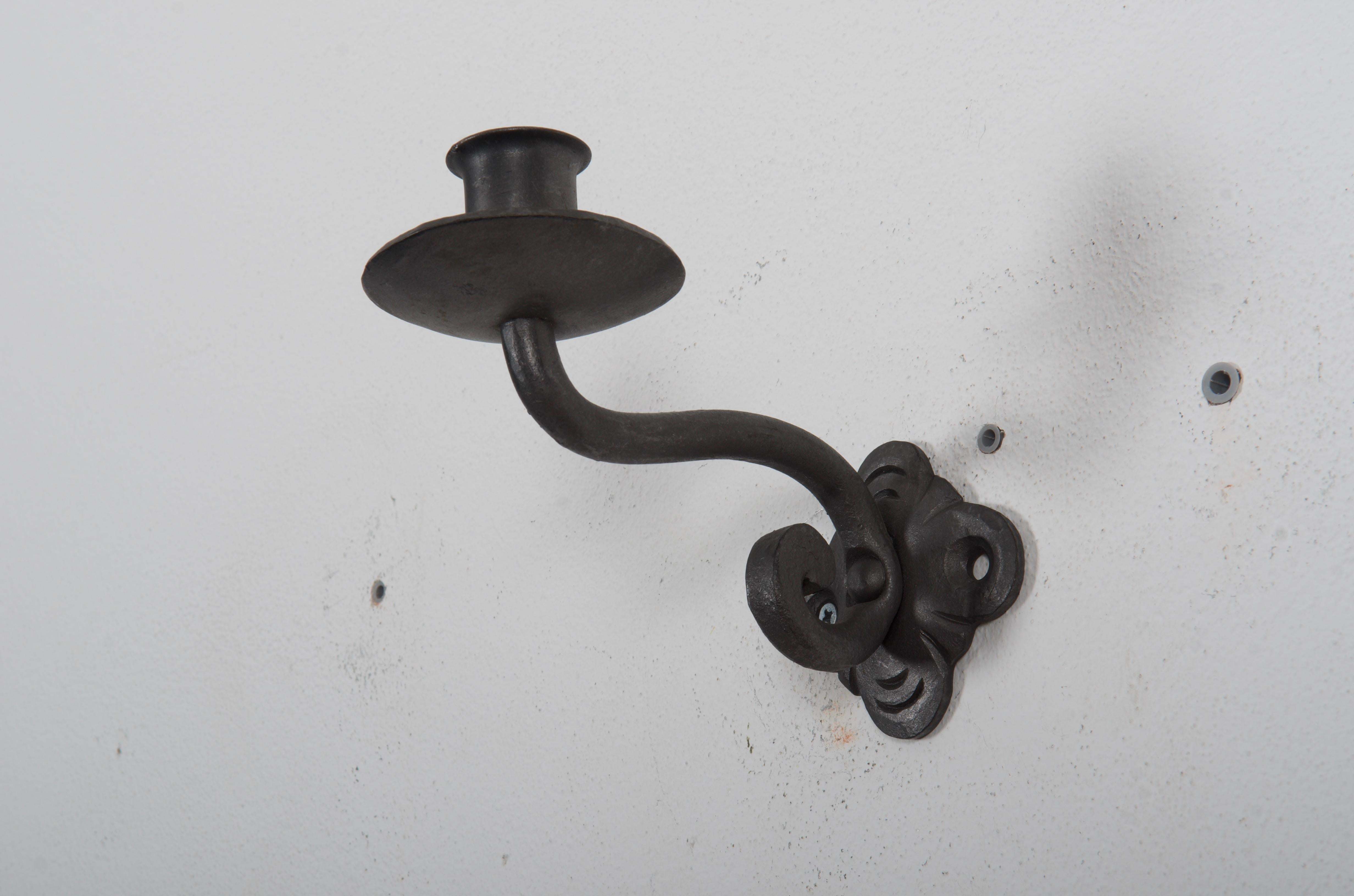 Wrought iron wall candleholder handmade in Styria Austria in the 1950s.