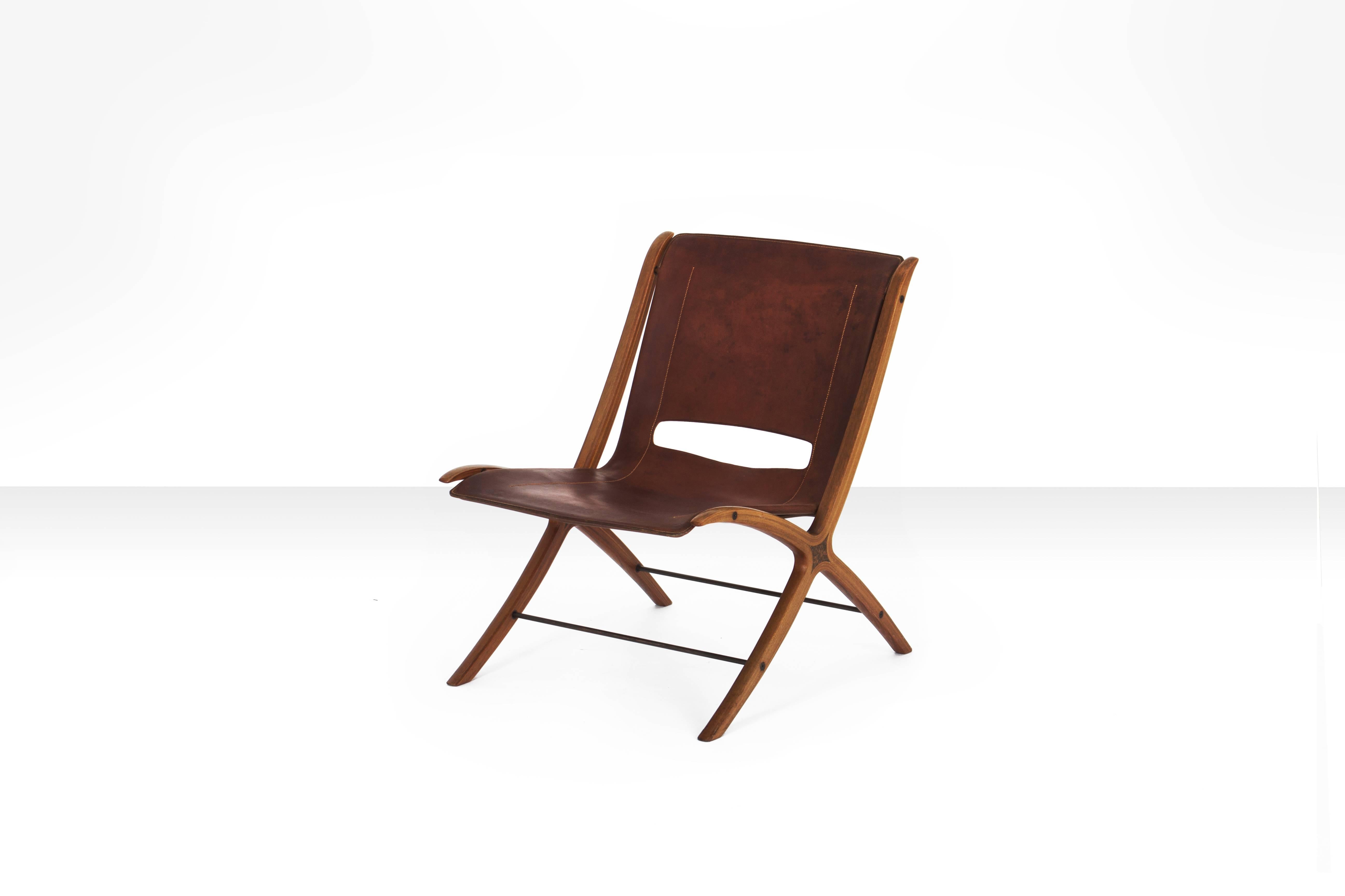 Beautiful X-chair designed by Peter Hvidt & Orla Mølgaard-Nielsen in cognac leather and mahogany. Produced by Fritz Hansen, Denmark 1950s-1960s.

Especially in cognac leather this work is very rare. 

Condition:
Item is in beautiful vintage