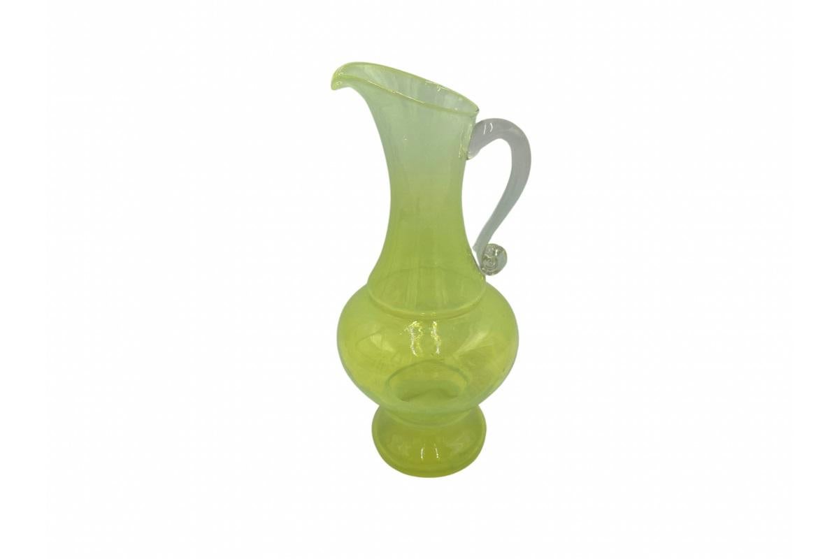 A glass jug, a vase designed by Ludwik Fiedorowicz. Glassworks in Ząbkowice, Poland, 1970s. Very good condition, no damage. Colour: Neon green/yellow.

Dimensions: height 35 cm; width 20 cm.