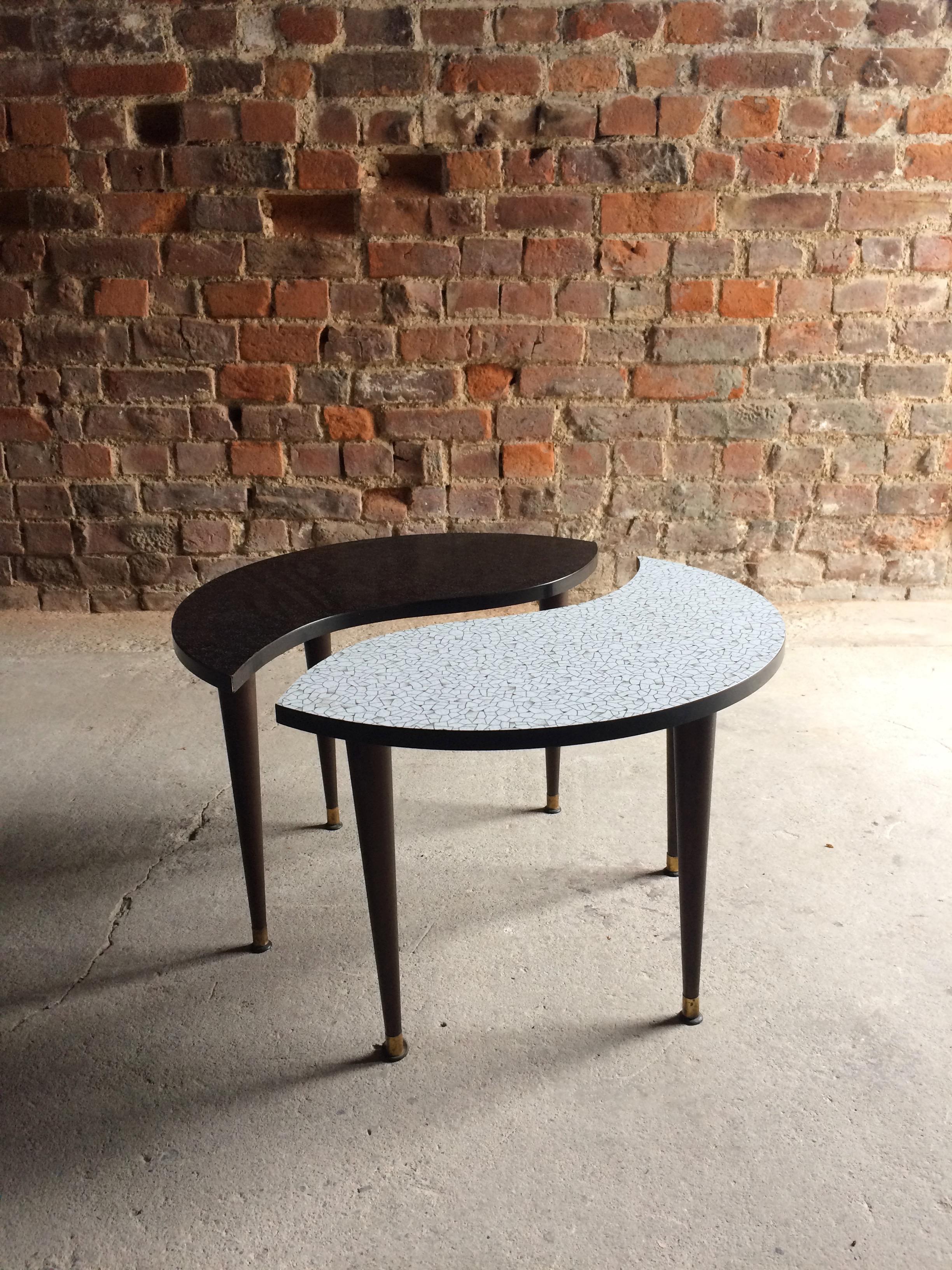 A magnificent and very beautiful Yin & Yang tripod occasional table, circa 1950s, the circular top showing both sides of Yin & Yang, the tables separate in two on tripod legs with brass ends.

Condition: This item is offered in excellent vintage