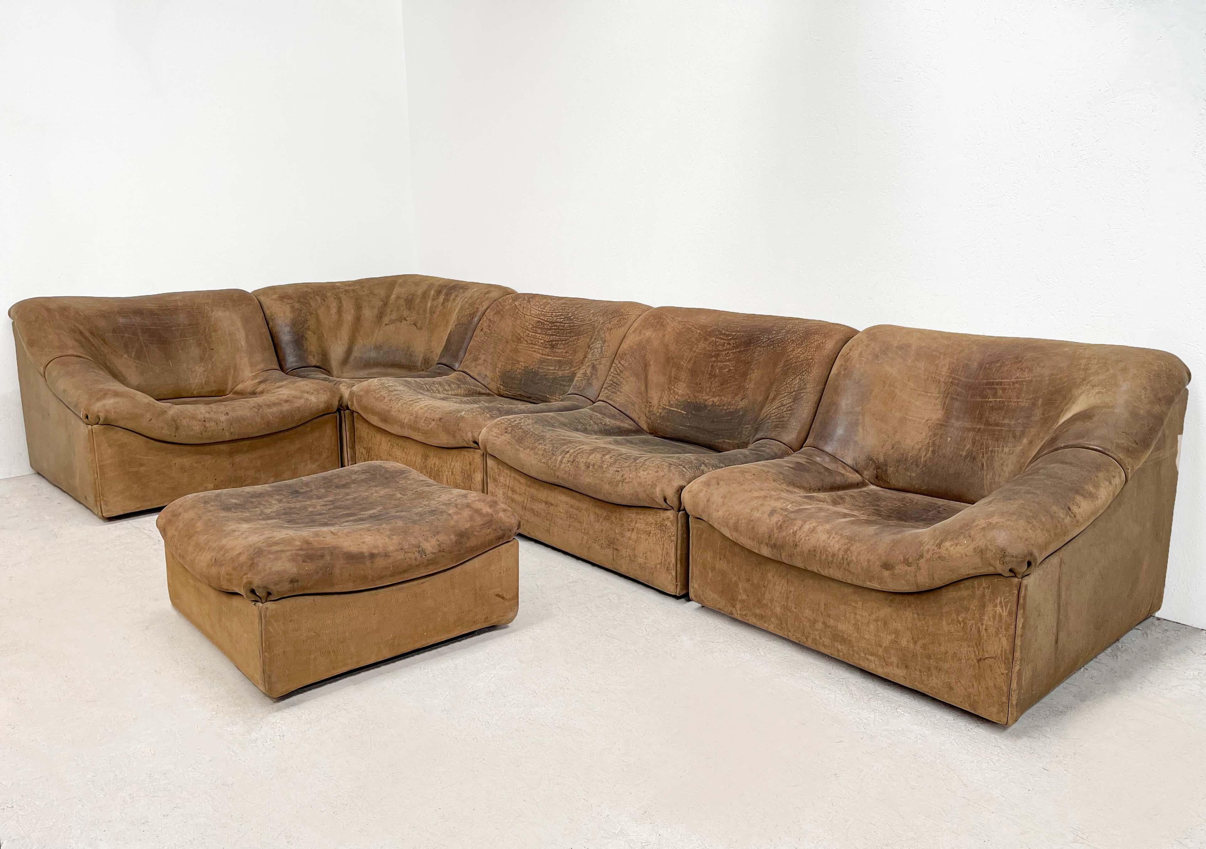 A very impressive sofa from one of the most famous furniture manufacturers in Switzerland De Sede. De Sede designed this sofa in the 70s. This DS46 is from the 80s. It consists of 5 pieces and 1 rare ottoman. 

For those who love patina this is