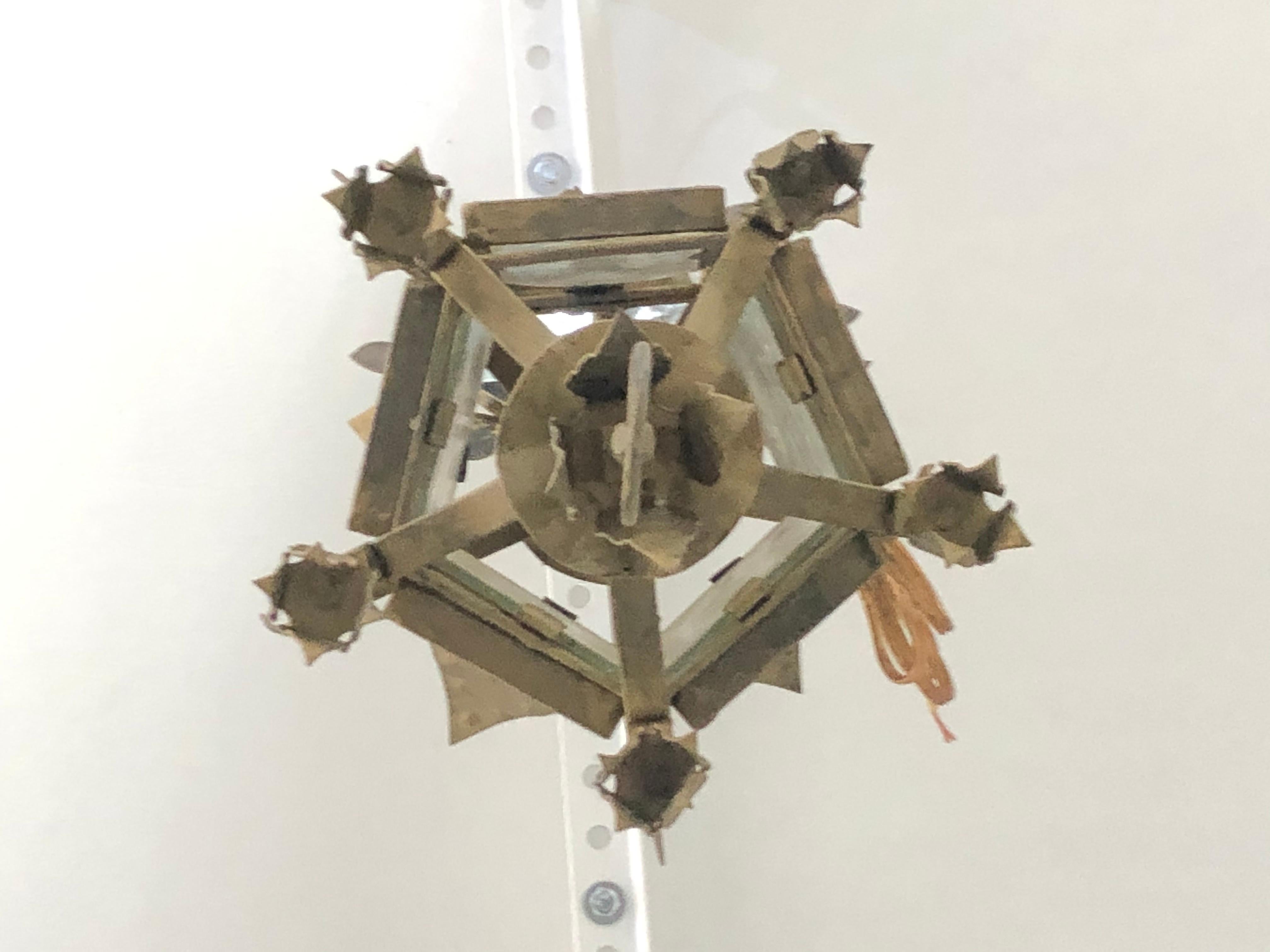 This stylish Addison Mizner style Spanish Colonial style hand-wrought iron chandelier was acquired from a Palm Beach estate, and they date to the 1920s-1930s. 

Note: The have been professionally rewired and and additional 36