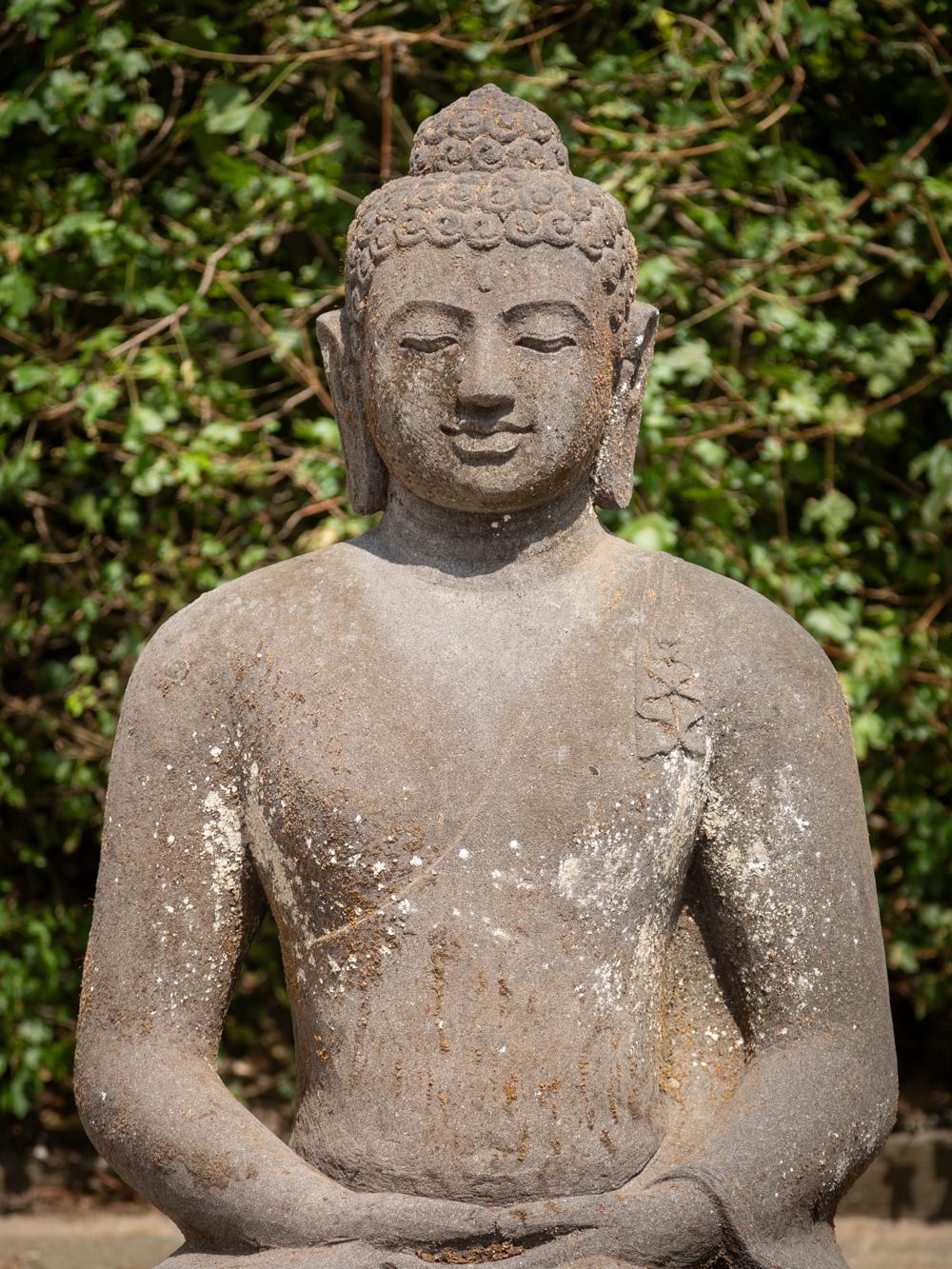 This large lavastone Buddha statue is a remarkable piece of art and spirituality. Crafted from lavastone, it stands at an impressive height of 109 cm, with dimensions of 83 cm in width and 58 cm in depth. Its estimated weight of approximately 300 kg