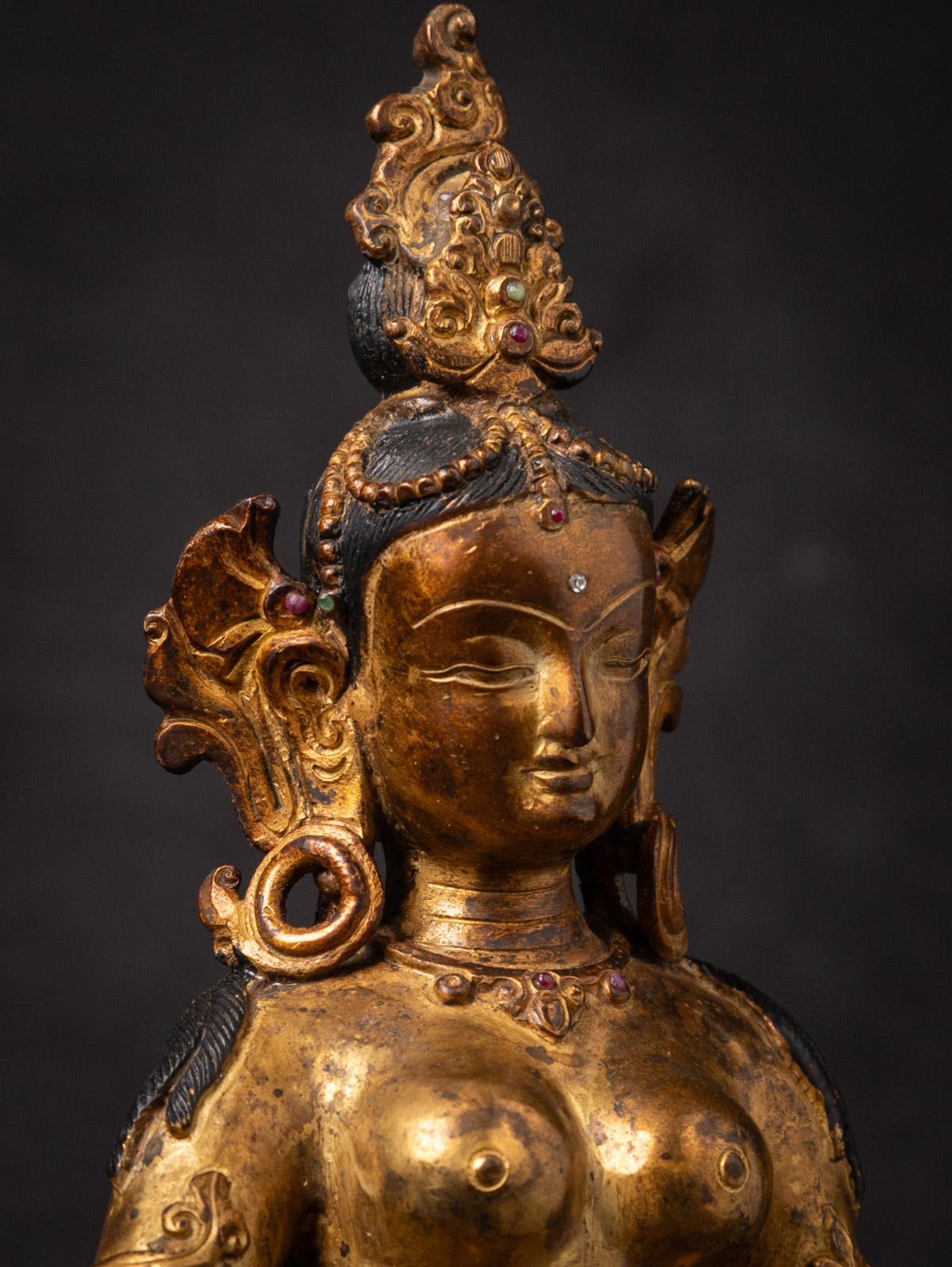 Middle 20th century Old bronze Nepali Basundhara statue in Varada Mudra In Good Condition For Sale In DEVENTER, NL