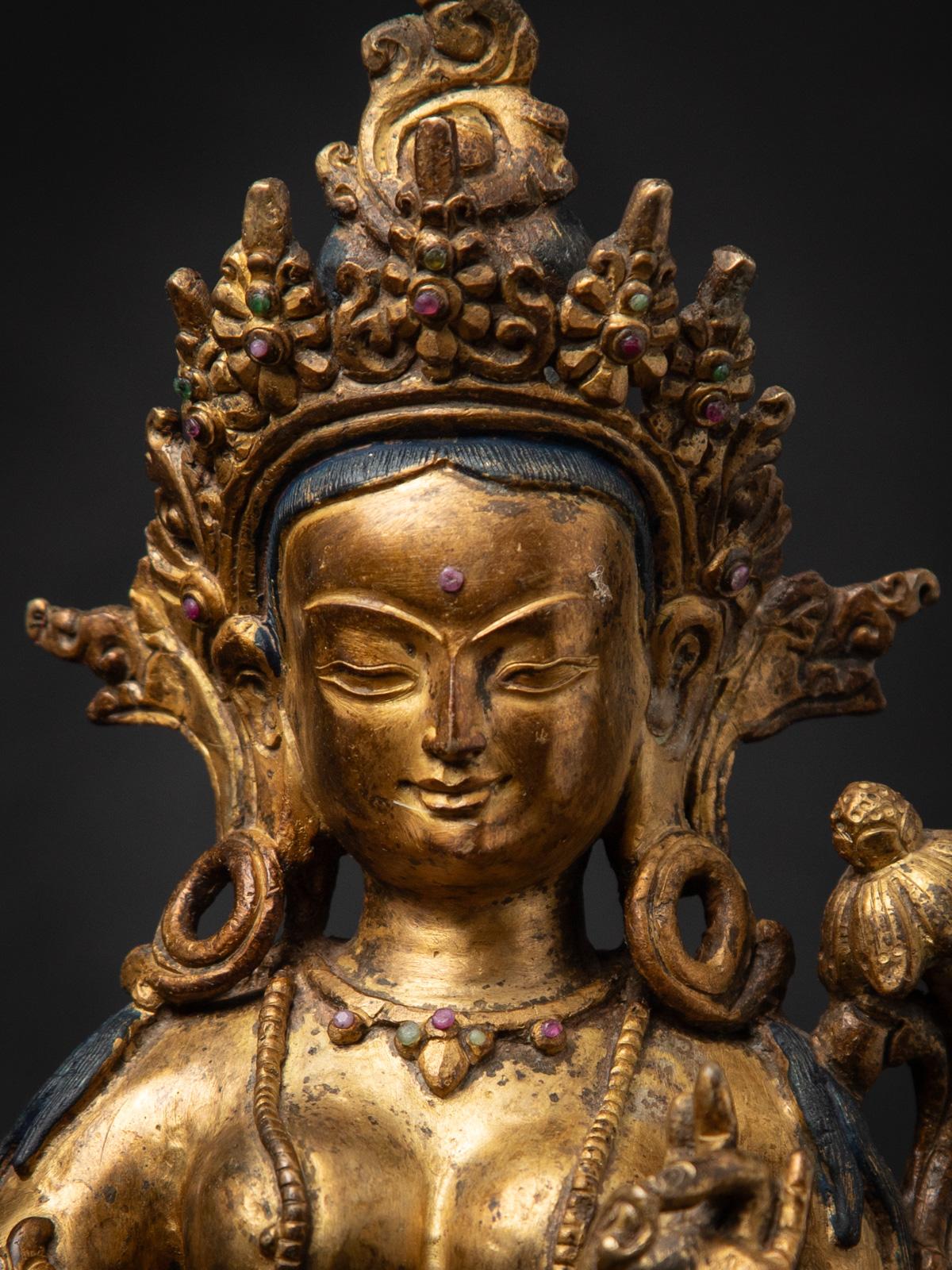 Bronze Middle 20th century Old bronze Nepali Basundhara statue in Varada Mudra