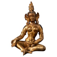 Used Middle 20th century Old bronze Nepali Basundhara statue in Varada Mudra