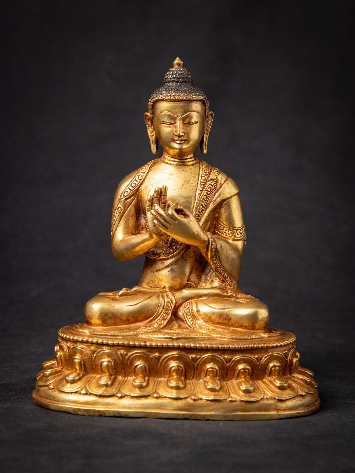 Old bronze Nepali Buddha statue

Material : bronze
19,9 cm high
17,3 cm wide and 12,2 cm deep
Fire gilded with 24 krt. gold
Dharmachakra mudra
Middle 20th century
Weight: 1,57 kgs
Originating from Nepal
