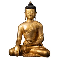 Middle 20th century old bronze Nepali Buddha statue in Bhumisparsha Mudra
