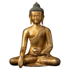 Middle 20th century Old bronze Nepali Buddha statue in Bhumisparsha Mudra
