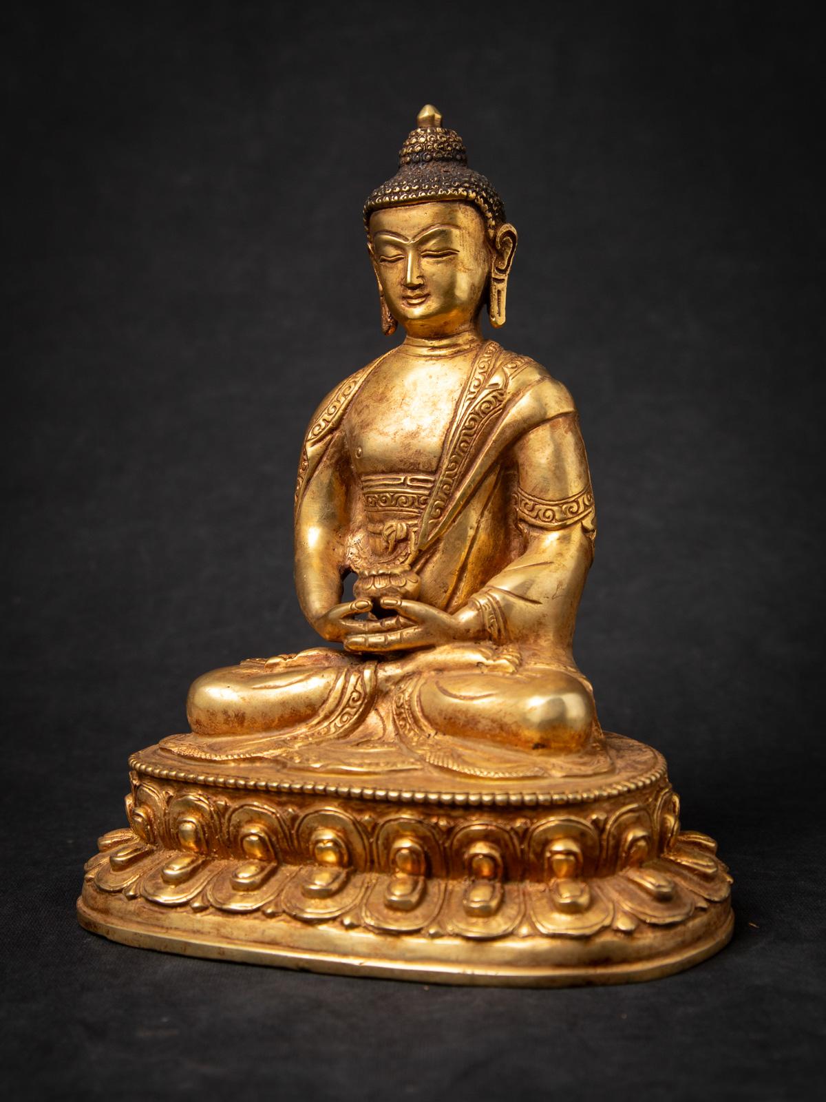 The Old bronze Nepali Buddha statue is a remarkable and spiritually significant artifact originating from Burma. Crafted from bronze , each statue stands at 20,9 cm in height and measures 17,1 cm in width and 12,2 cm in depth. 

Created in the