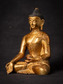 Middle 20th century Old bronze Nepali Buddha statue in Varada Mudra