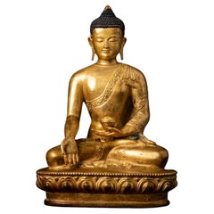 Middle 20th century Old bronze Nepali Buddha statue in Varada Mudra