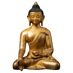 Middle 20th century Old bronze Nepali Buddha statue in Varada mudra