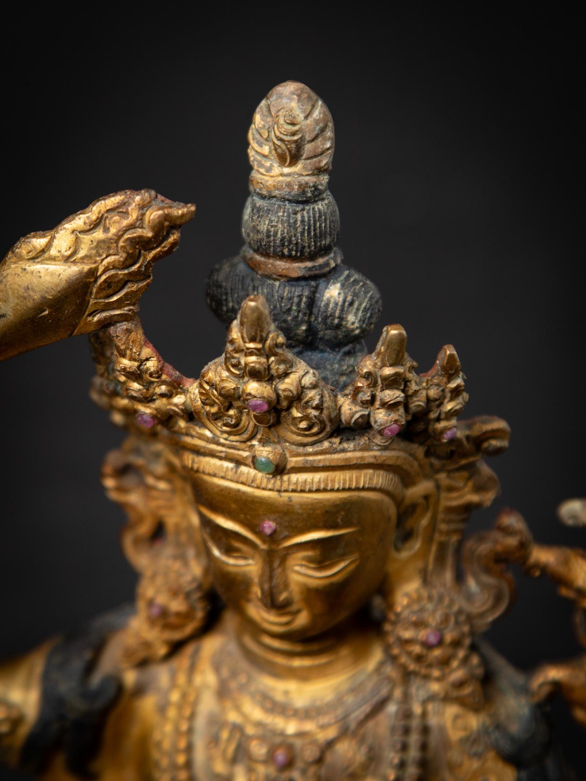 Burmese Middle 20th century Old bronze Nepali Manjushri statue from Nepal For Sale