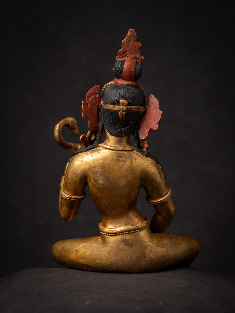 The old bronze Nepali Saraswati statue is a captivating and spiritually significant artifact originating from Nepal. Crafted from bronze and adorned with fire gilding in 24-karat gold, this statue stands at 27.4 cm in height and measures 13.3 cm in