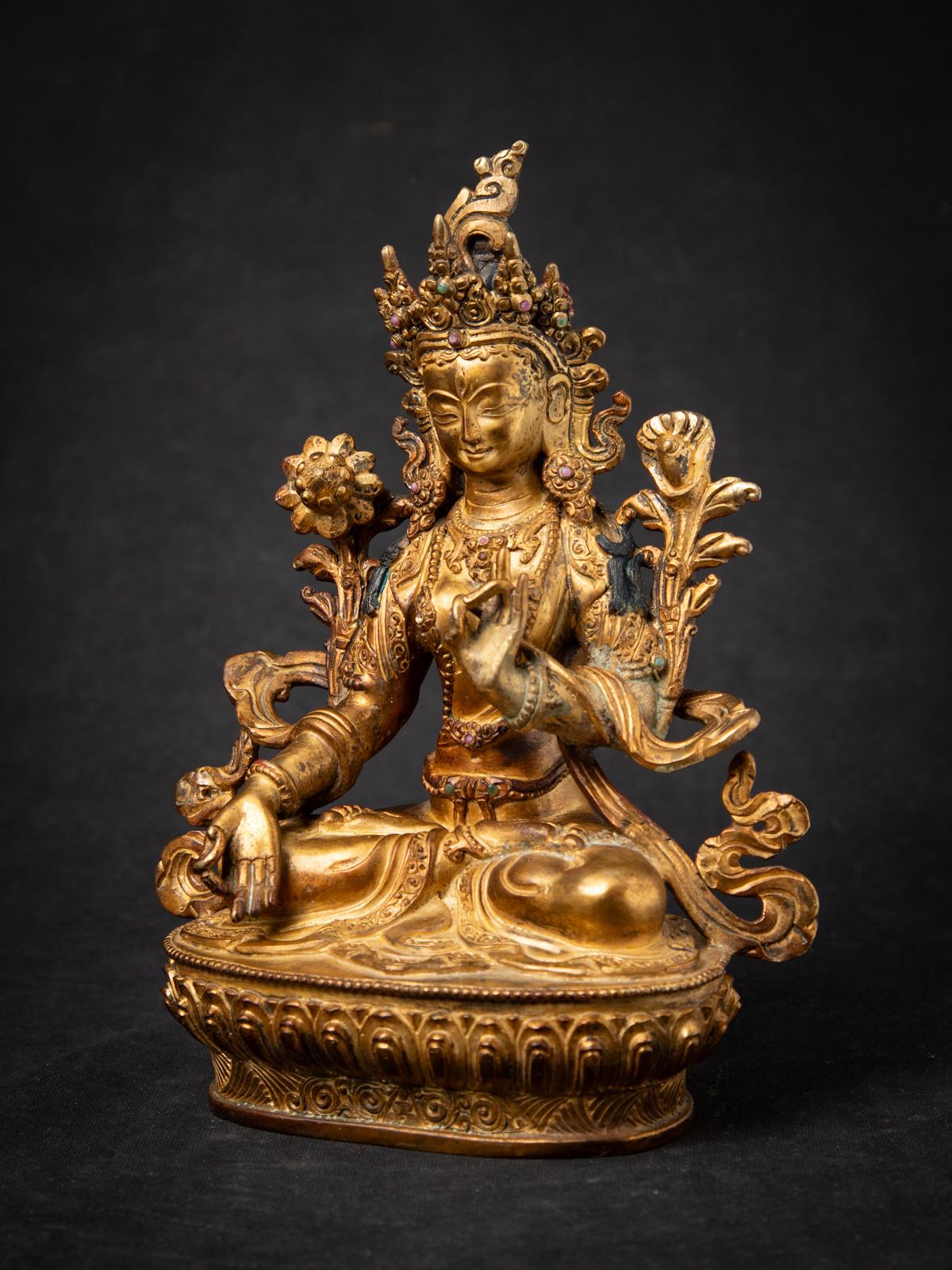 Old bronze Nepali White Tara statue
Material : bronze
22,1 cm high
16,5 cm wide and 9,4 cm deep
Fire gilded with 24 krt. gold
Varada mudra
Middle 20th century
Inlaid with gem stones
High quality !
Weight: 1,55 kgs
Originating from Nepal
Nr: 3850-15