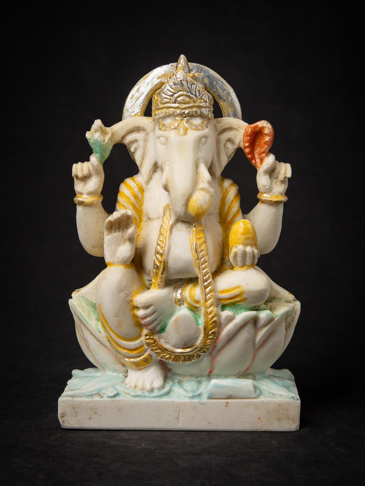 This old marble stone Ganesha statue from the mid-20th century is a striking example of traditional Indian sculpture. Carved from marble, the statue measures 31 cm high, 20 cm wide, and 9.5 cm deep, with a weight of 7.54 kgs, giving it a solid and