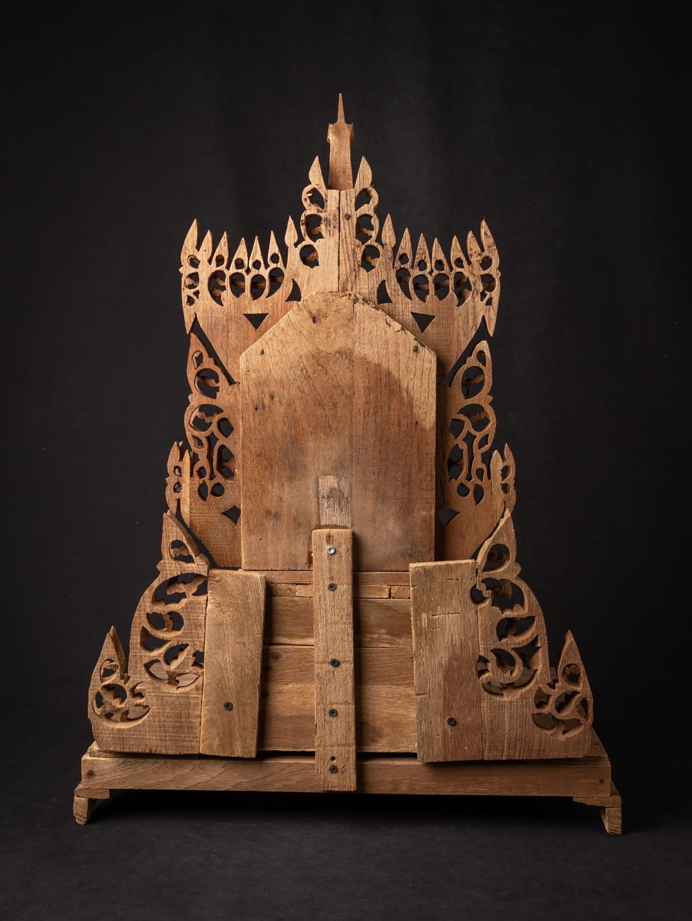 This Middle 20th century Old wooden Burmese Buddha Altar is a stunning testament to the rich spiritual and artistic heritage of Burma. Crafted from wood and standing at a height of 71,5 cm, with dimensions of 53 cm in width and 36 cm in depth, it