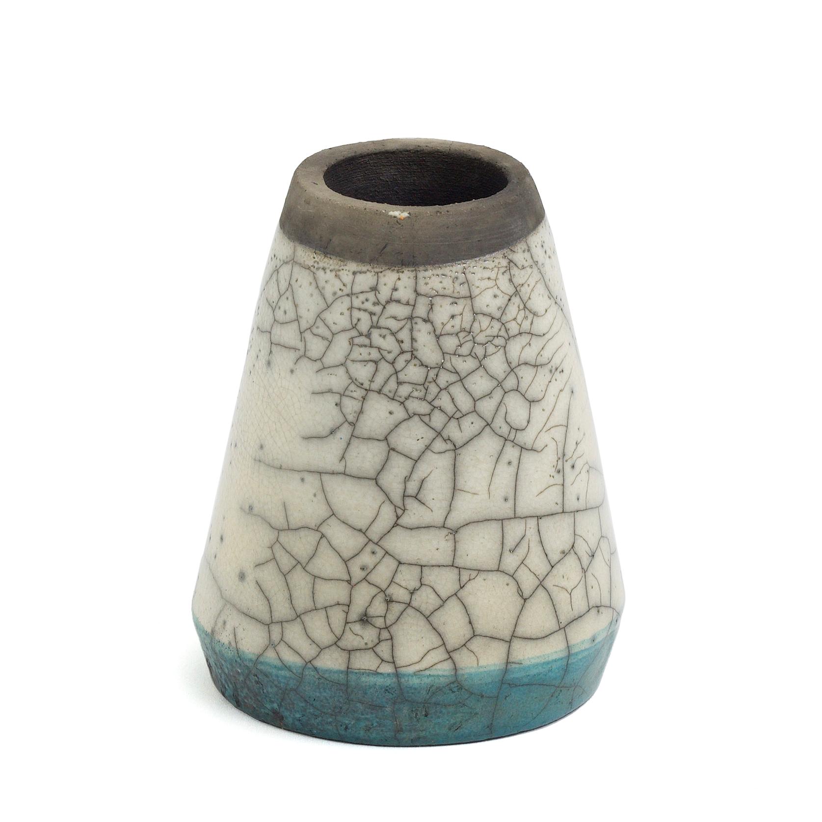 Kazan vase

Turquoise, crackle' and burnt colors overlapping and uncontainable in this vase that originates from the idea of the heat source used by ancient middle east potters. A geometrical shape that reminds of an ancient kiln used by the