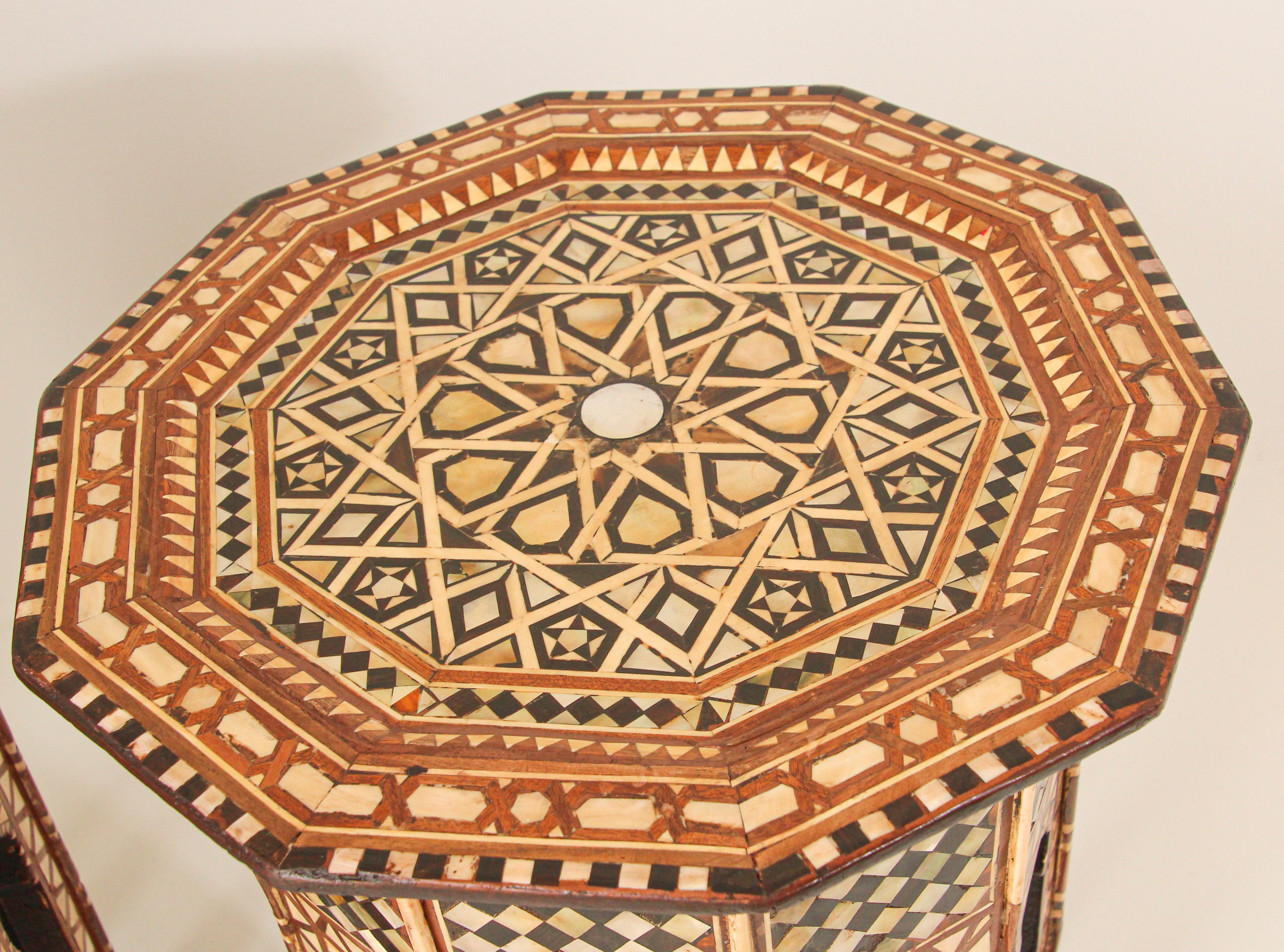 Set of two of Moorish walnut octagonal side tables inlaid with mosaic marquetry with Moorish arches on the eight sides,
Handcrafted by skilled artisans.
Great addition for any Moroccan room project.
Very intricate inlay Moorish